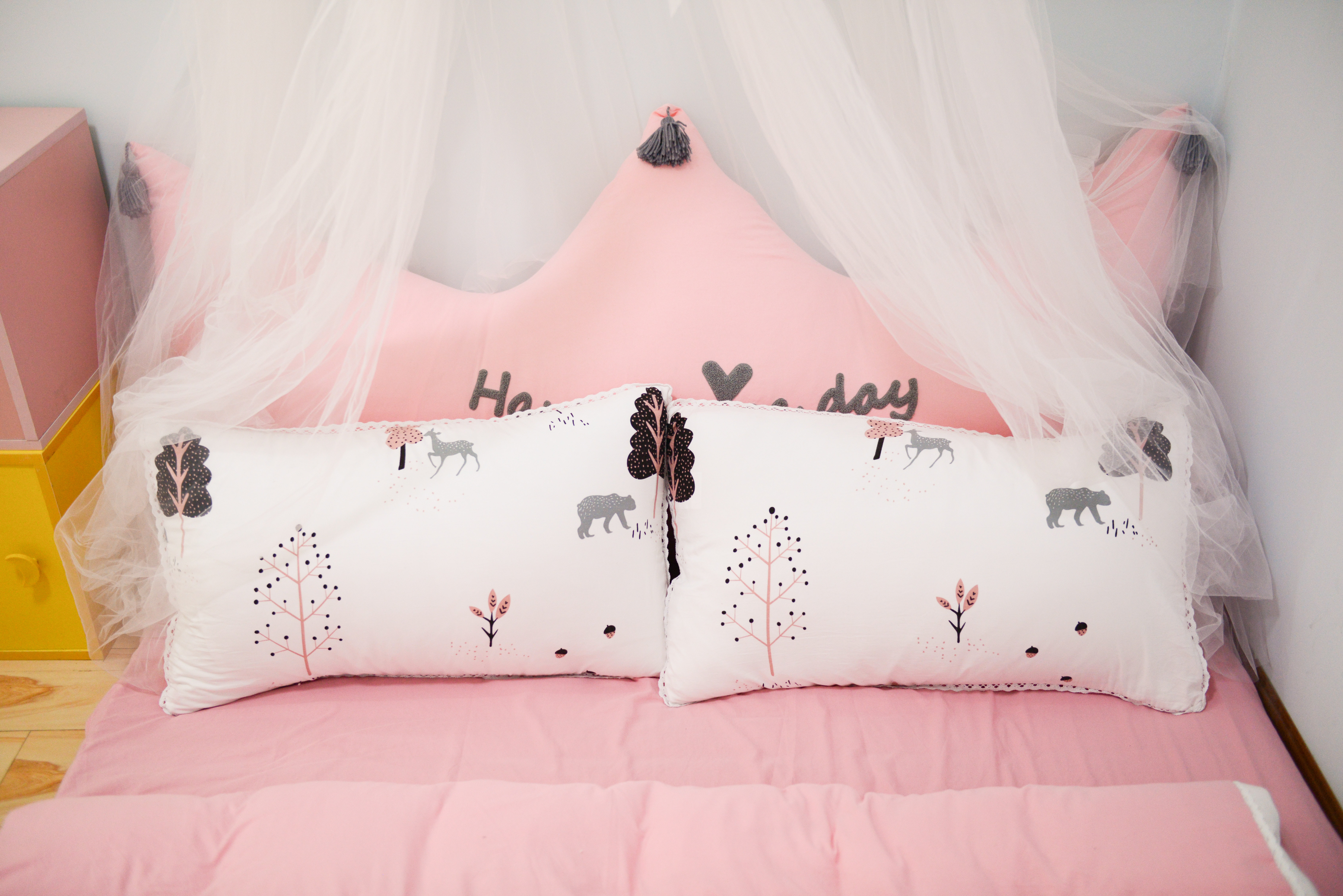 Photo of two pillows on the bed
