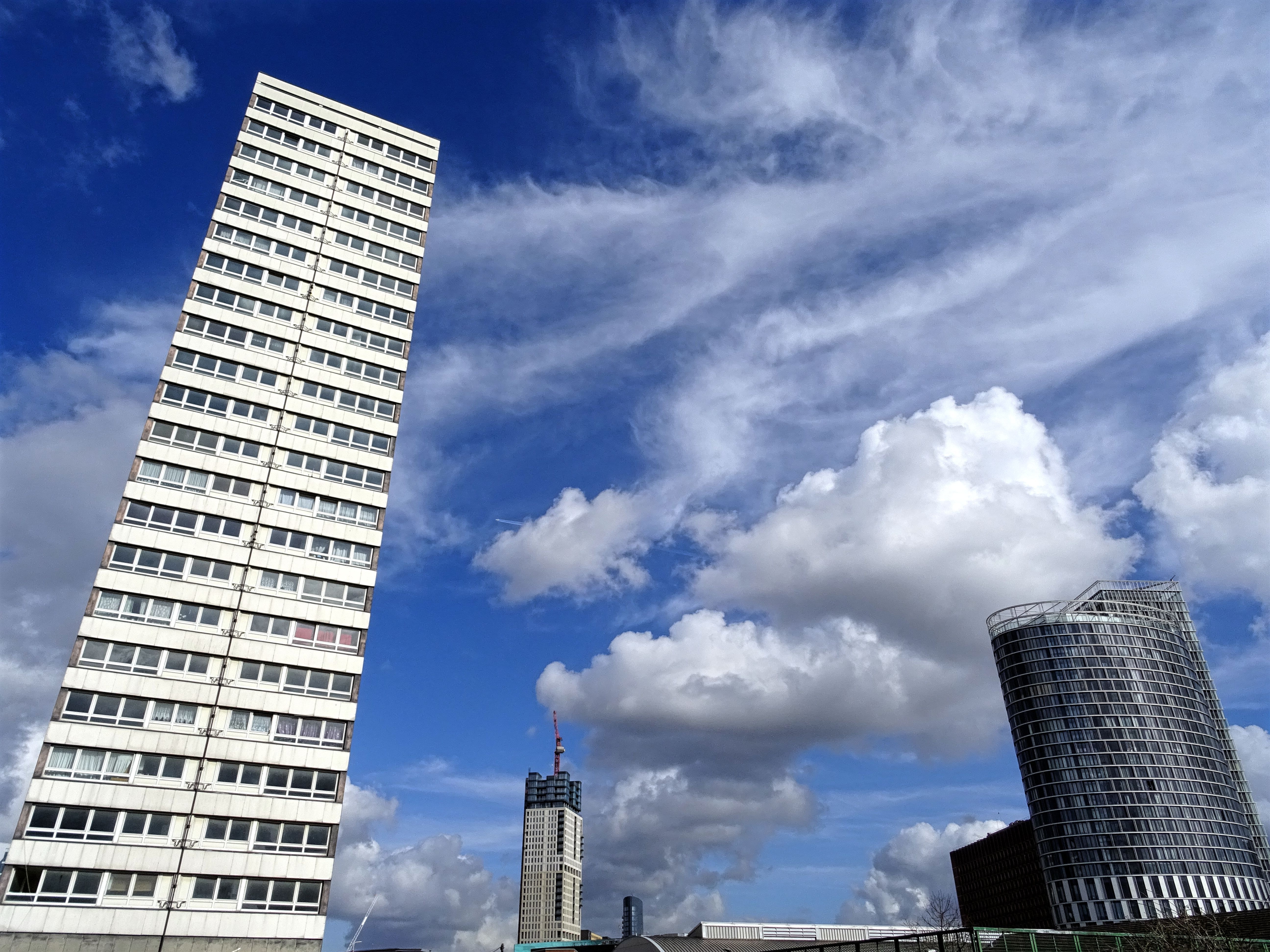 Photo of two white and black high rise buildings