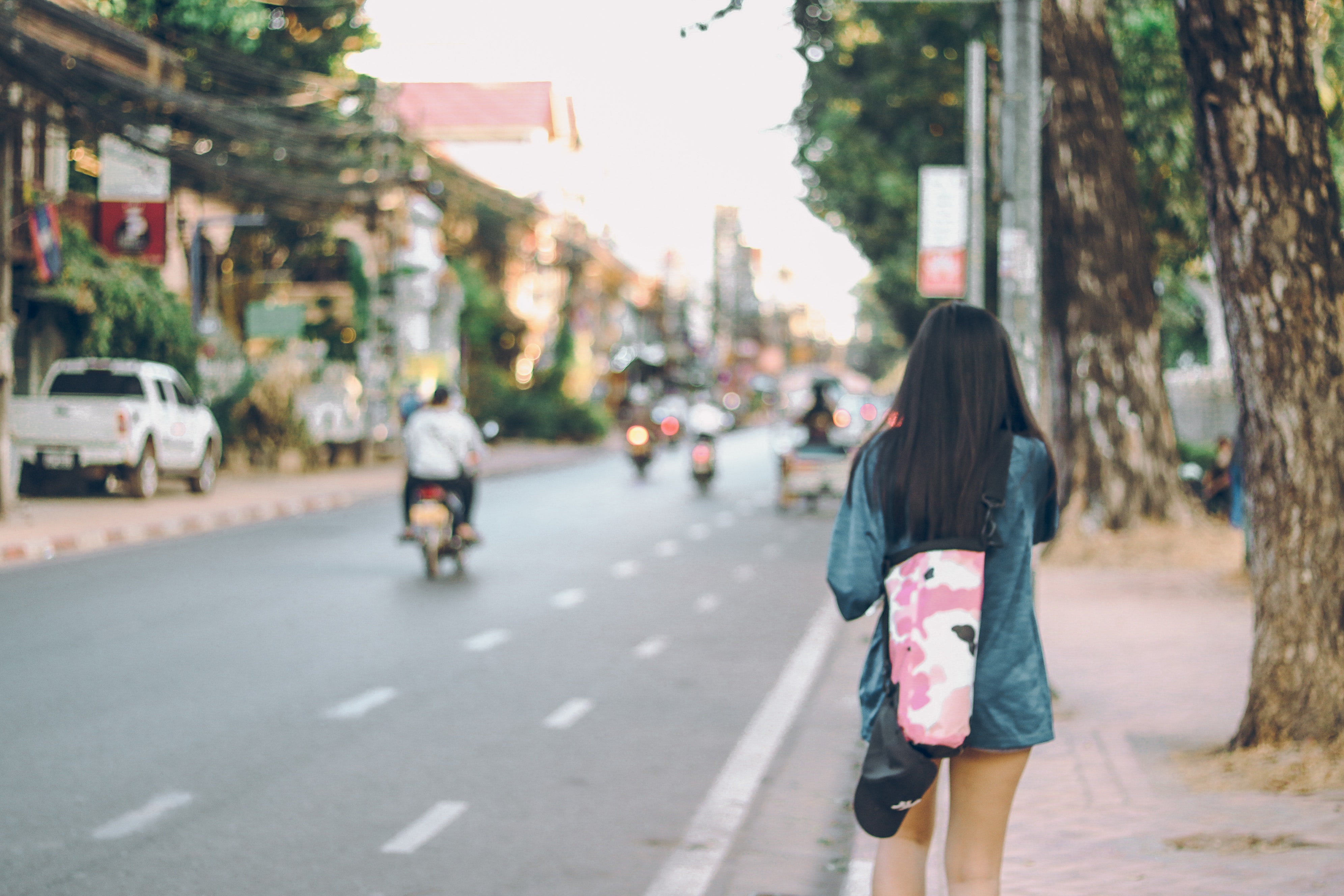 Photo of woman walking in the street