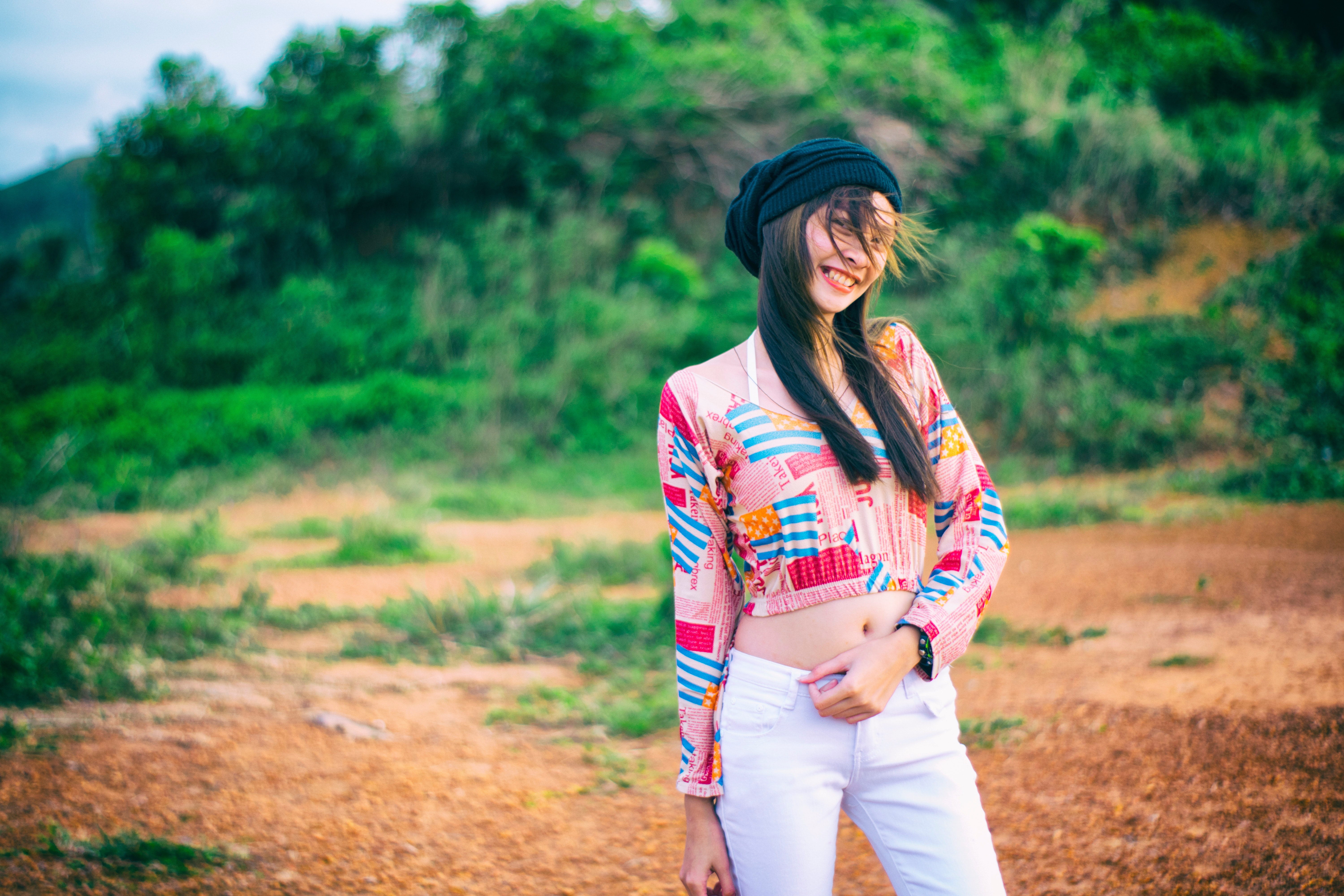 Photo of woman wearing colorful top