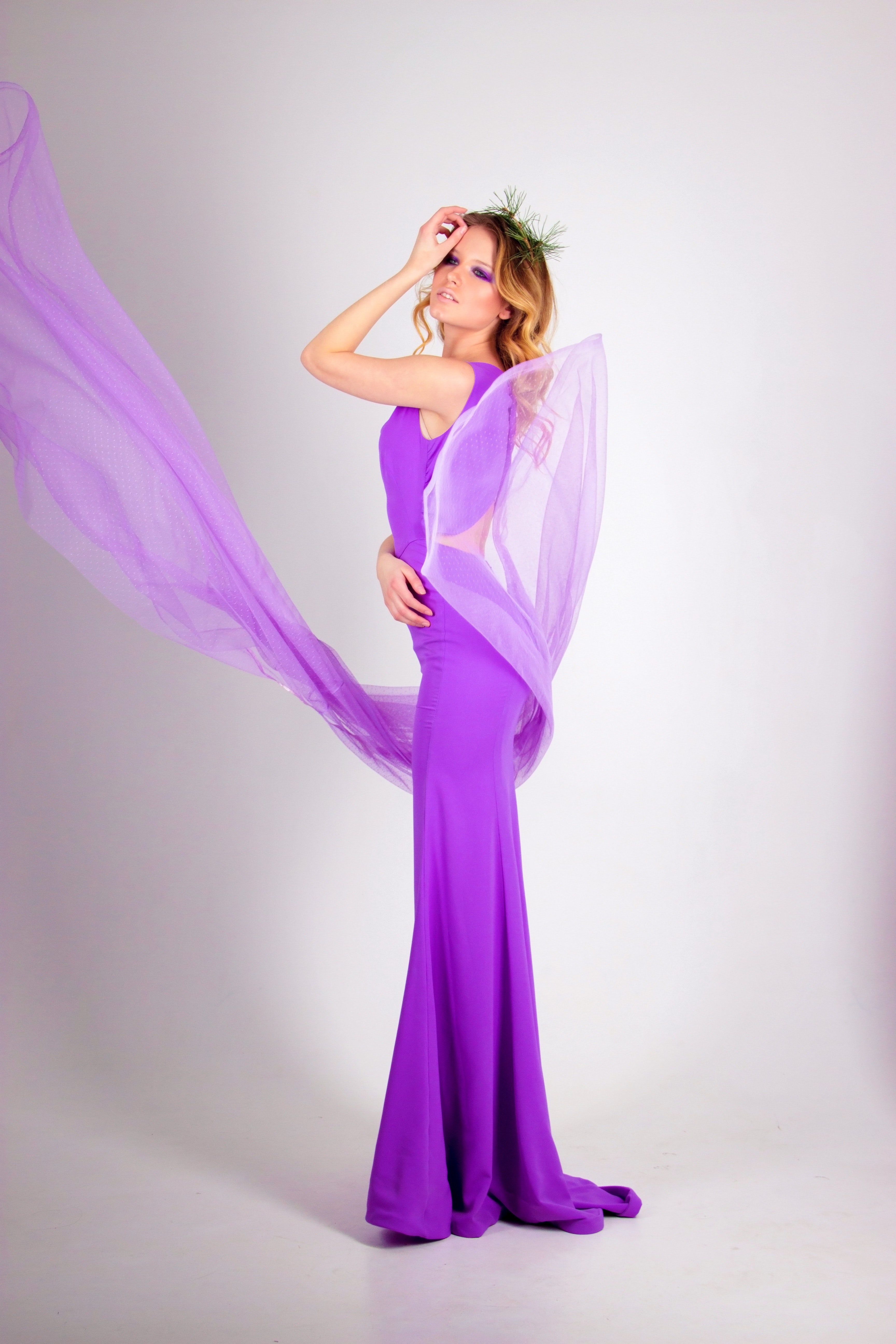 Photo shoot of woman wearing purple sleeveless long dress