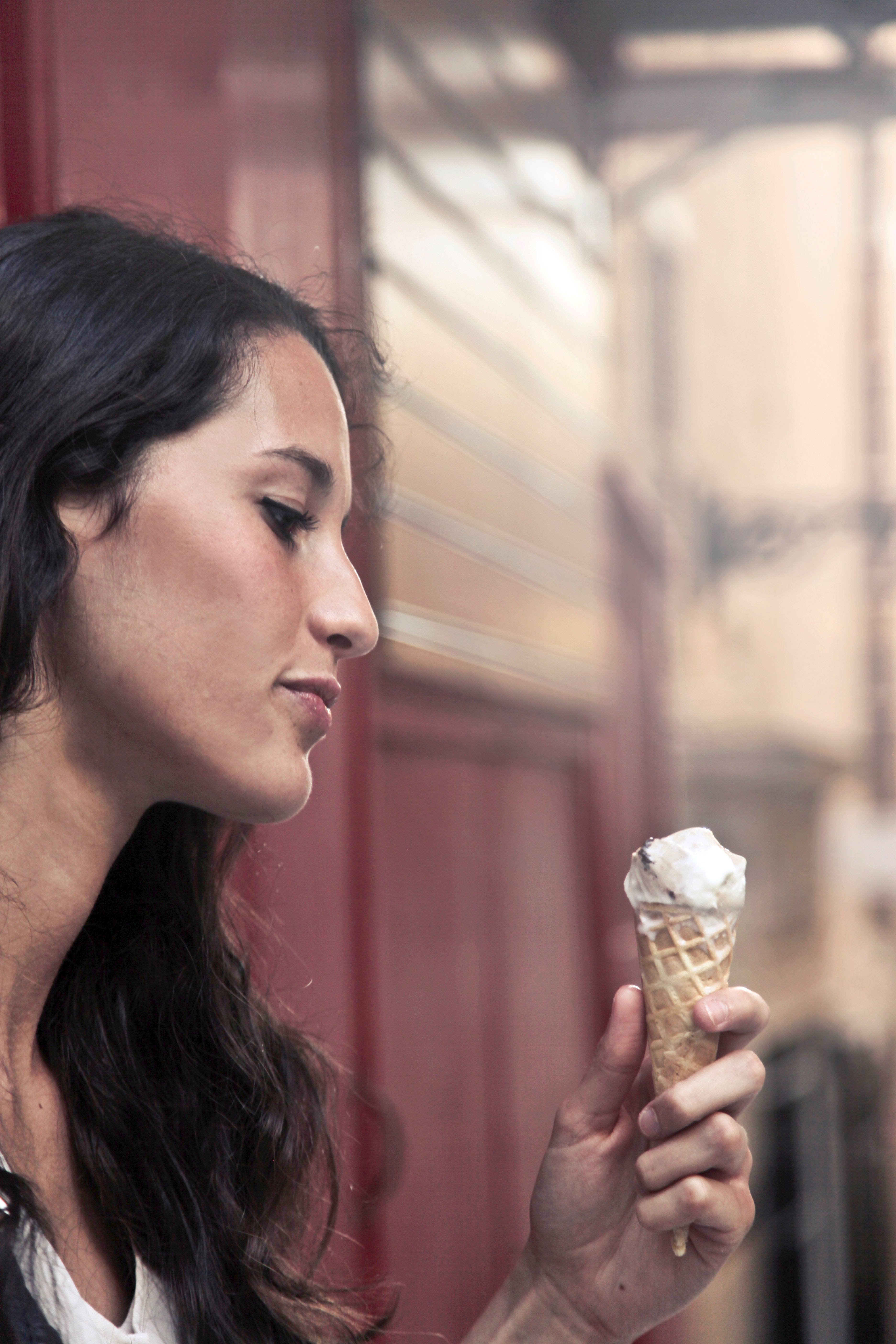 Photography of a woman holding ice cream