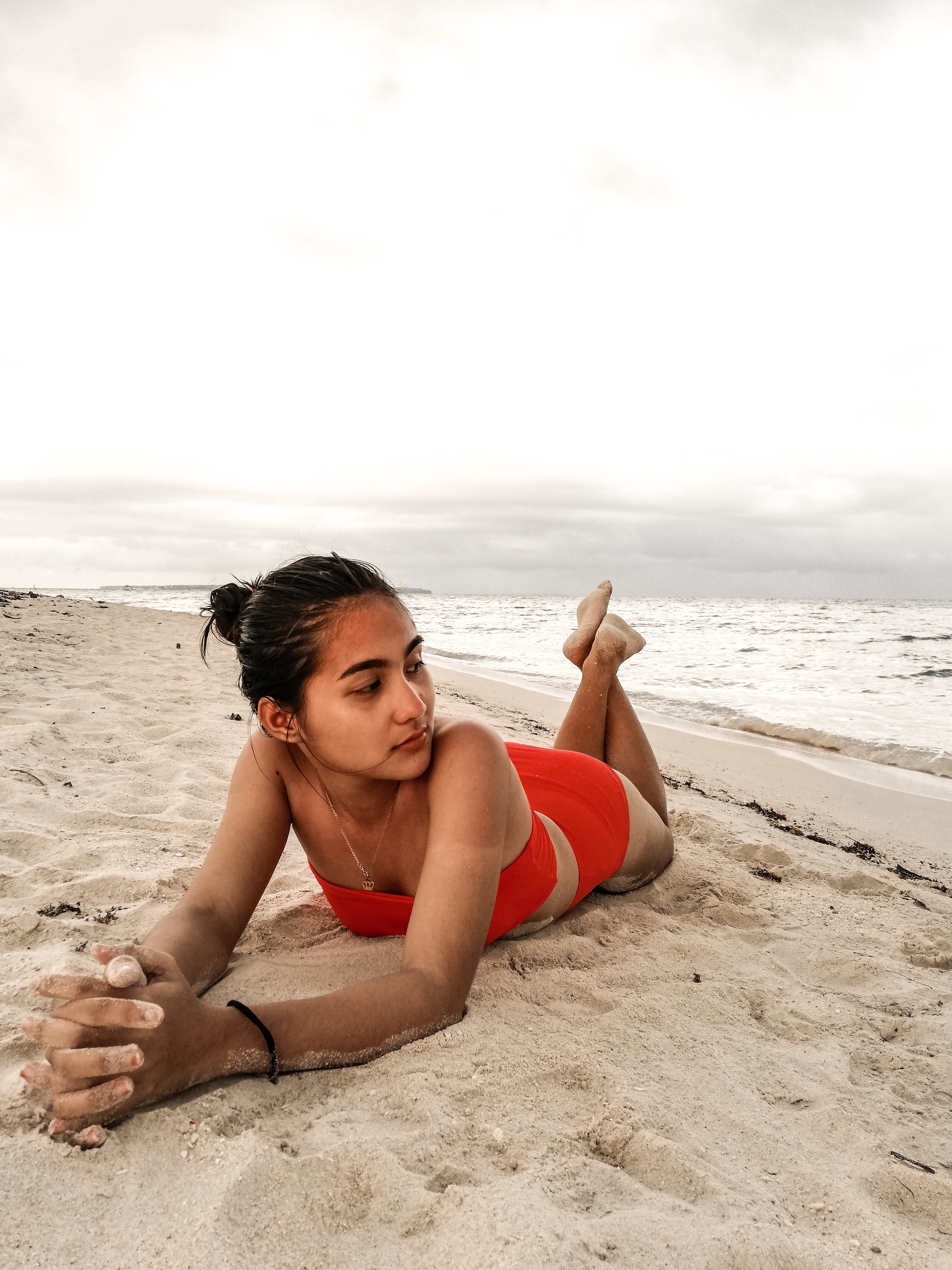 Woman Wearing Red Bikini Laying On Beach Sand · Free Stock Photo