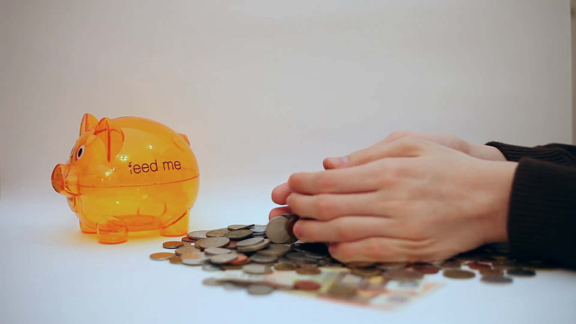 Hands dropping coins, counting money, piggy bank, fortune, cash ...