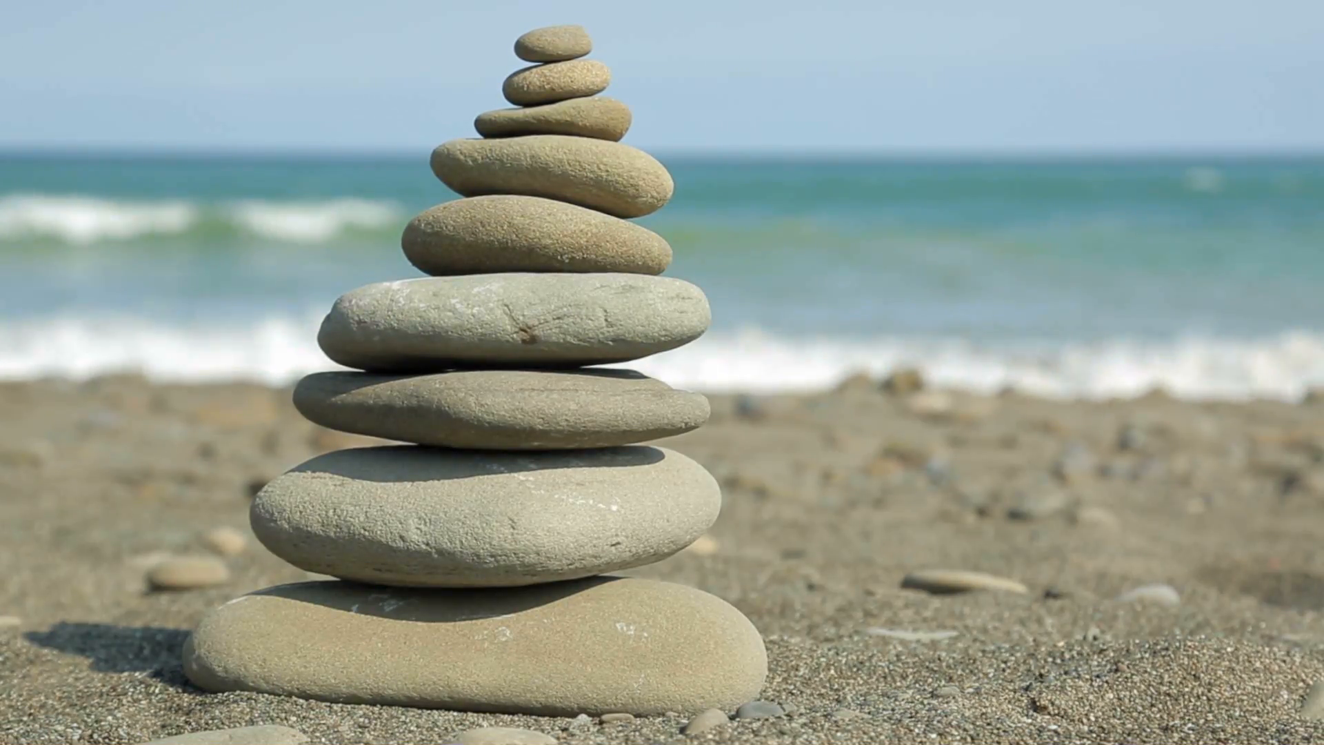 A quiet, peaceful Zen rock pile on an ocean beach Stock Video ...