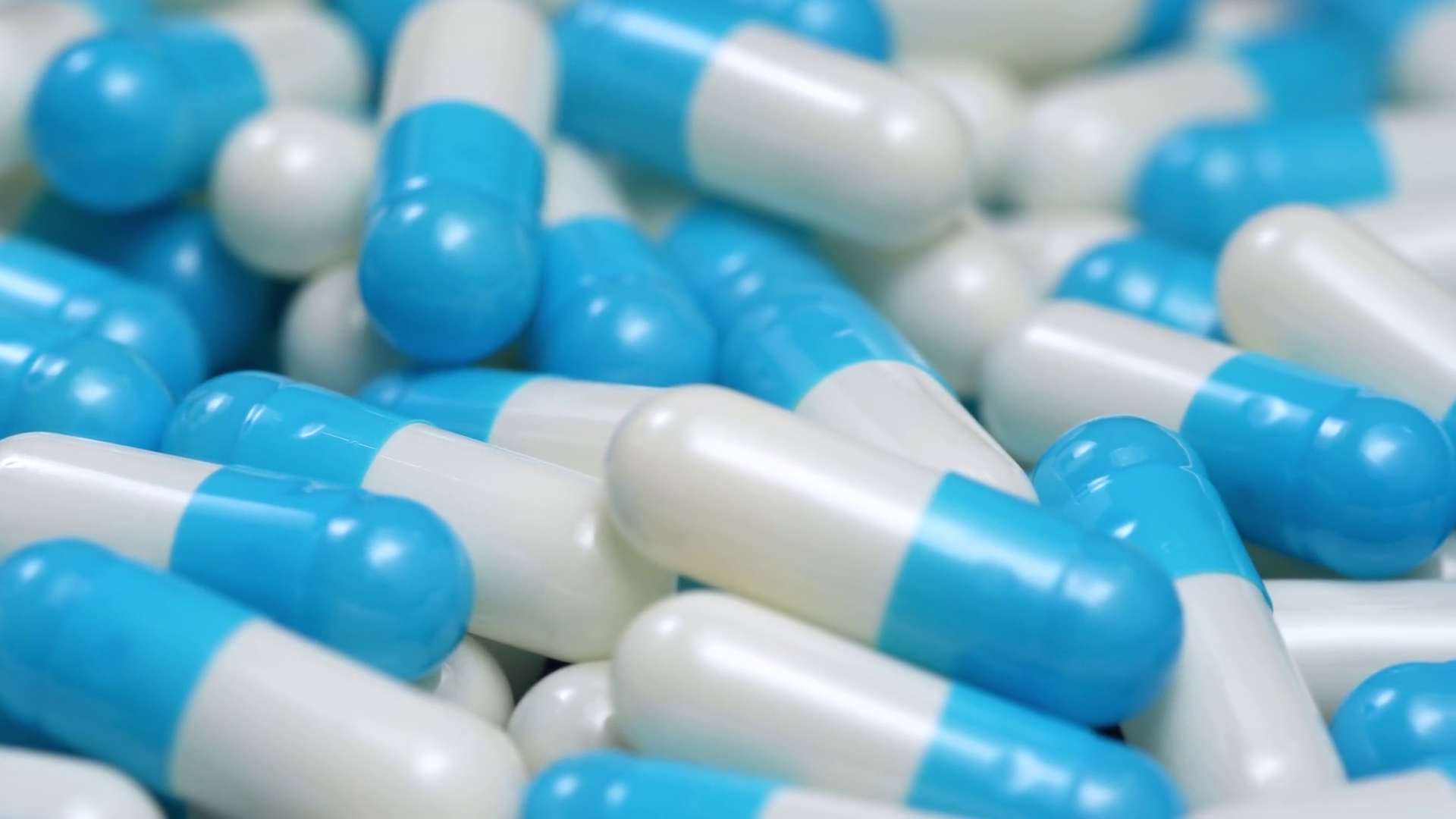 4K Blue and White Pills Capsules Camera Pan Stock Video Footage ...