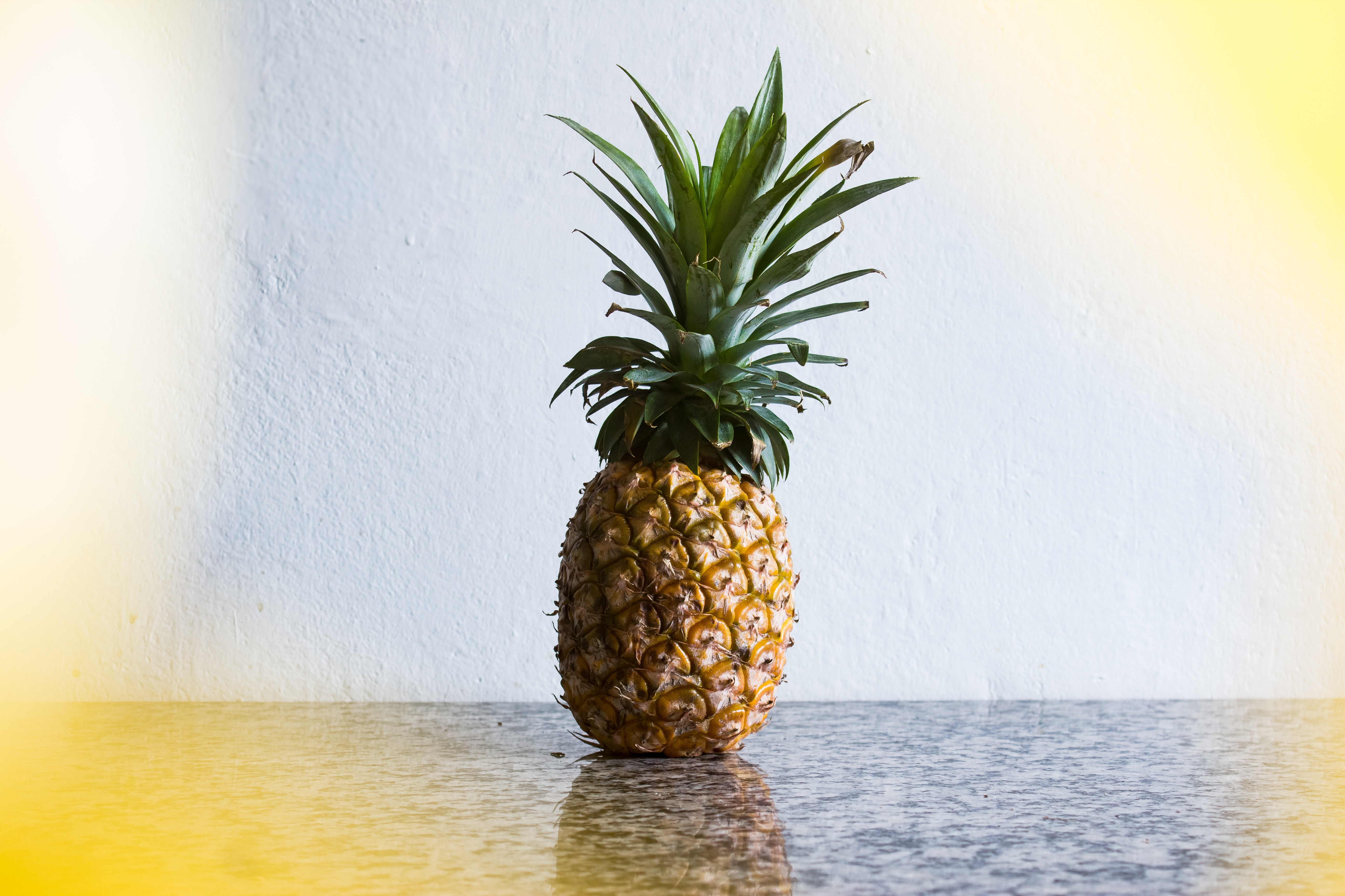 Pineapple fruit on gray table photo