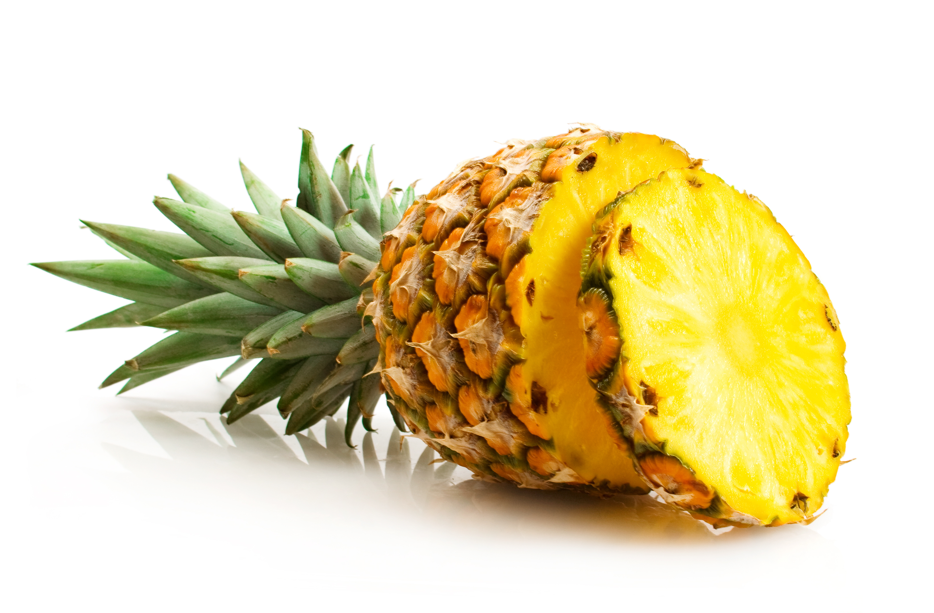 Pineapple with slices isolated on white photo