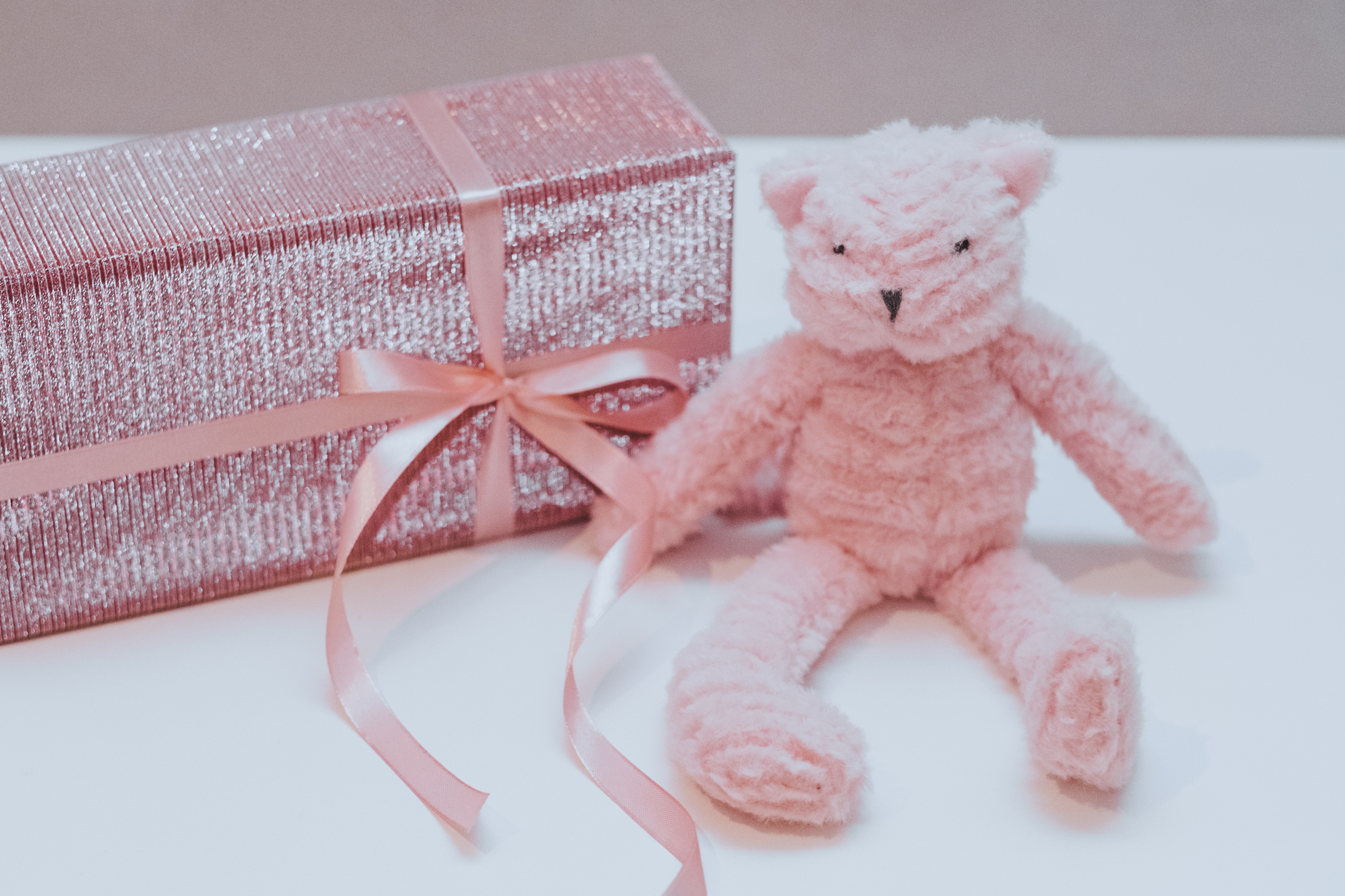 Pink bear plush toy with box photo