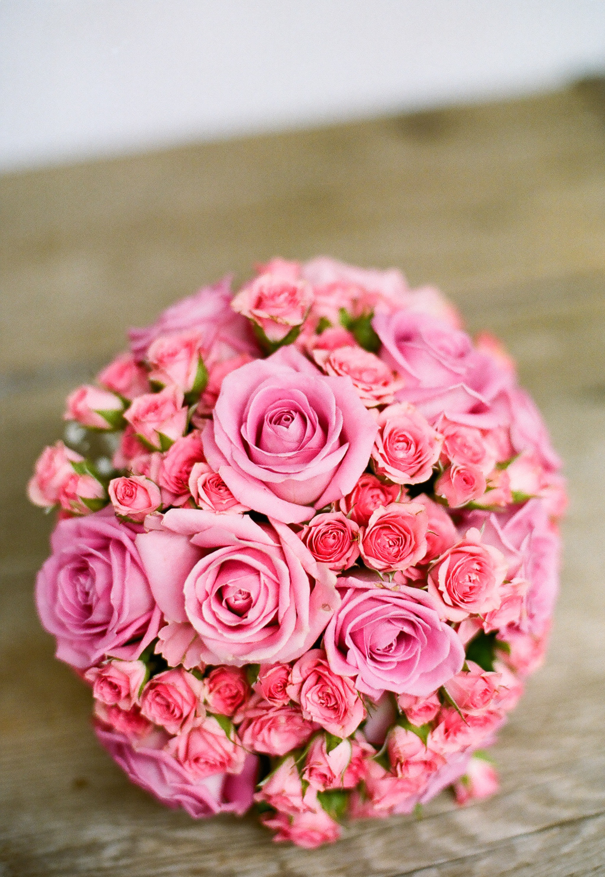 Pink bouquet of flowers on table photo