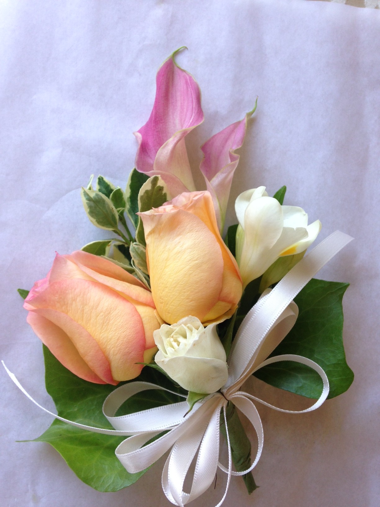 Corsage with pink calla lilies, peach roses and ivy in Los Angeles ...