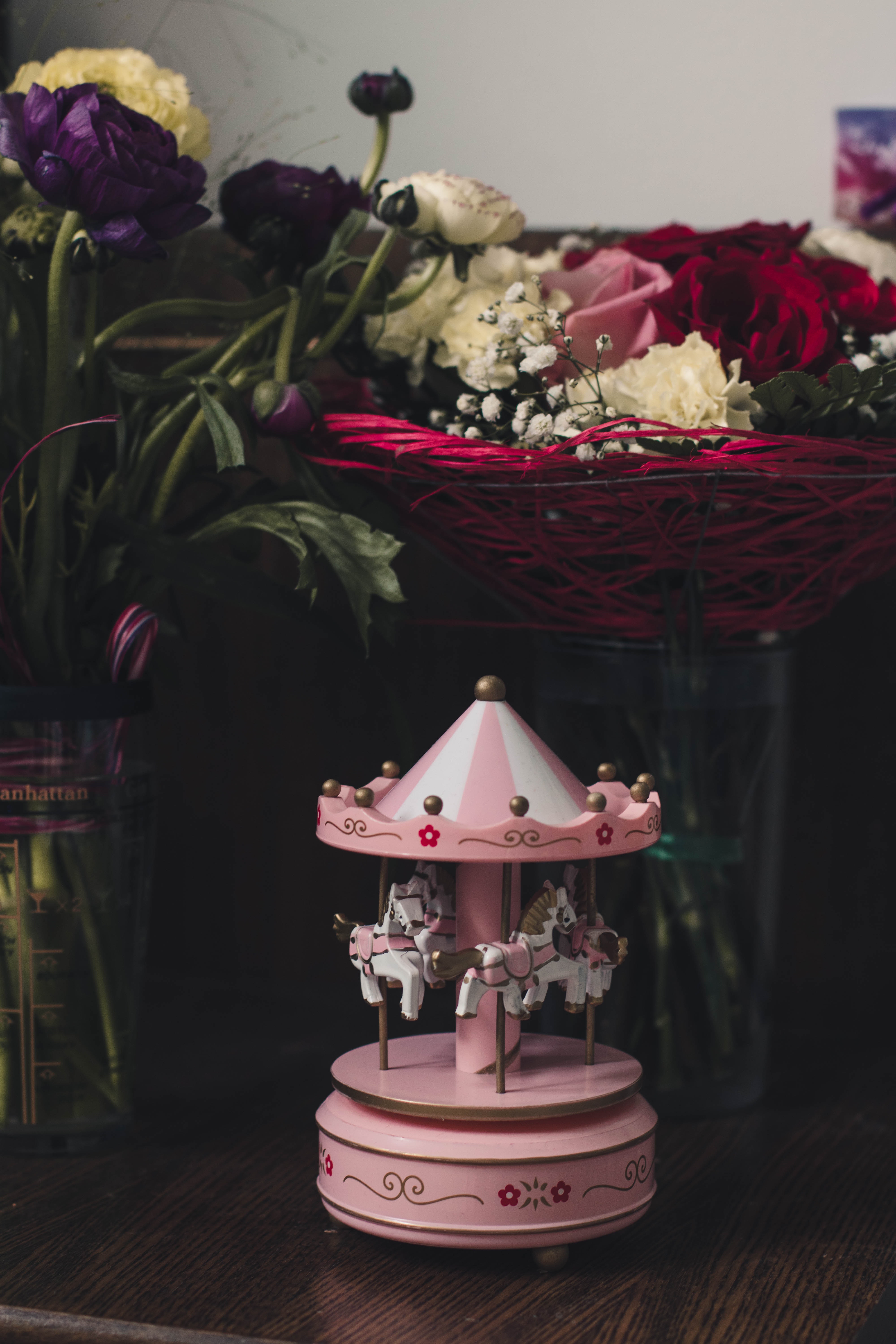 Pink carousel mini figurine on table photo