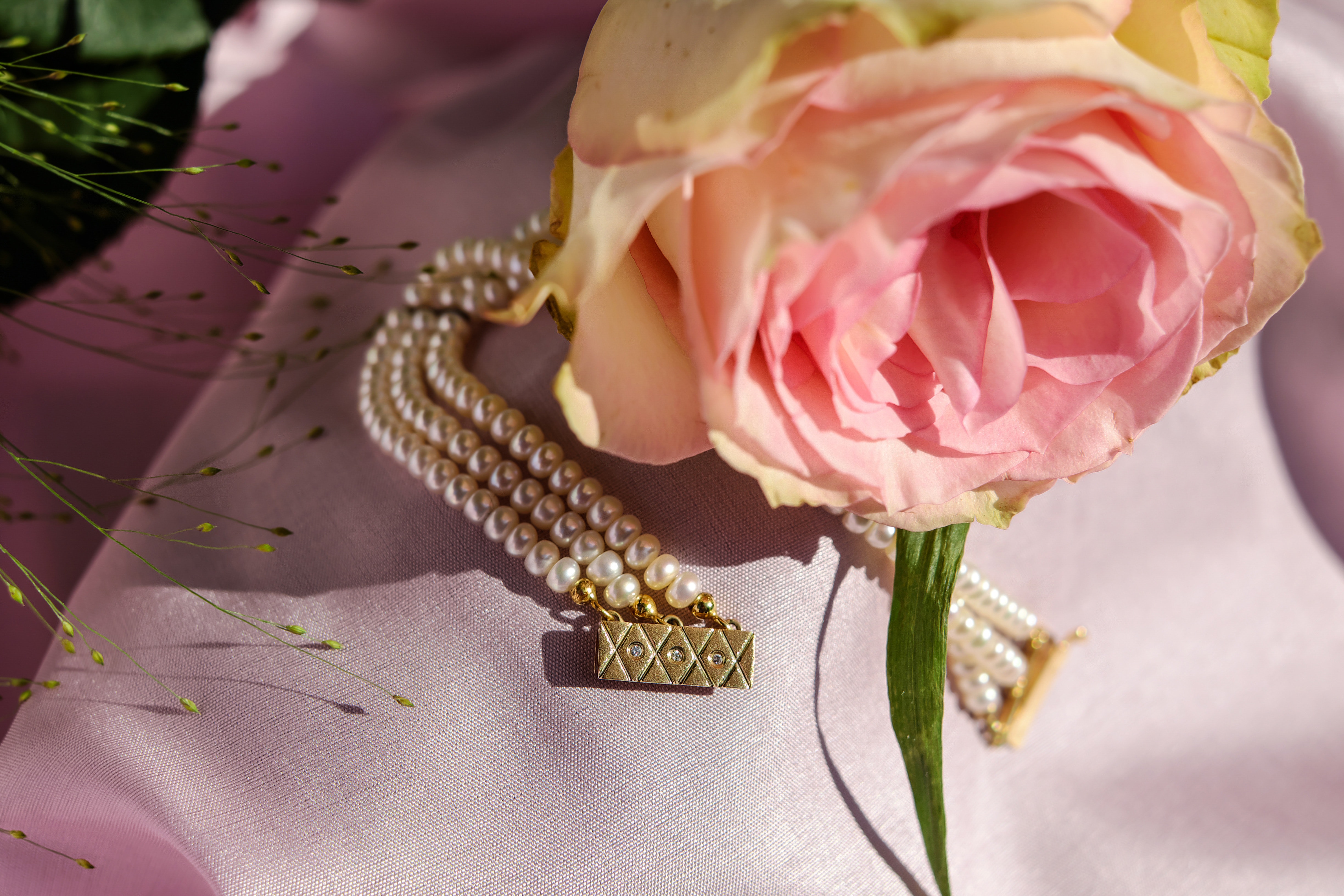 Pink rose and gold beaded jewelry photo