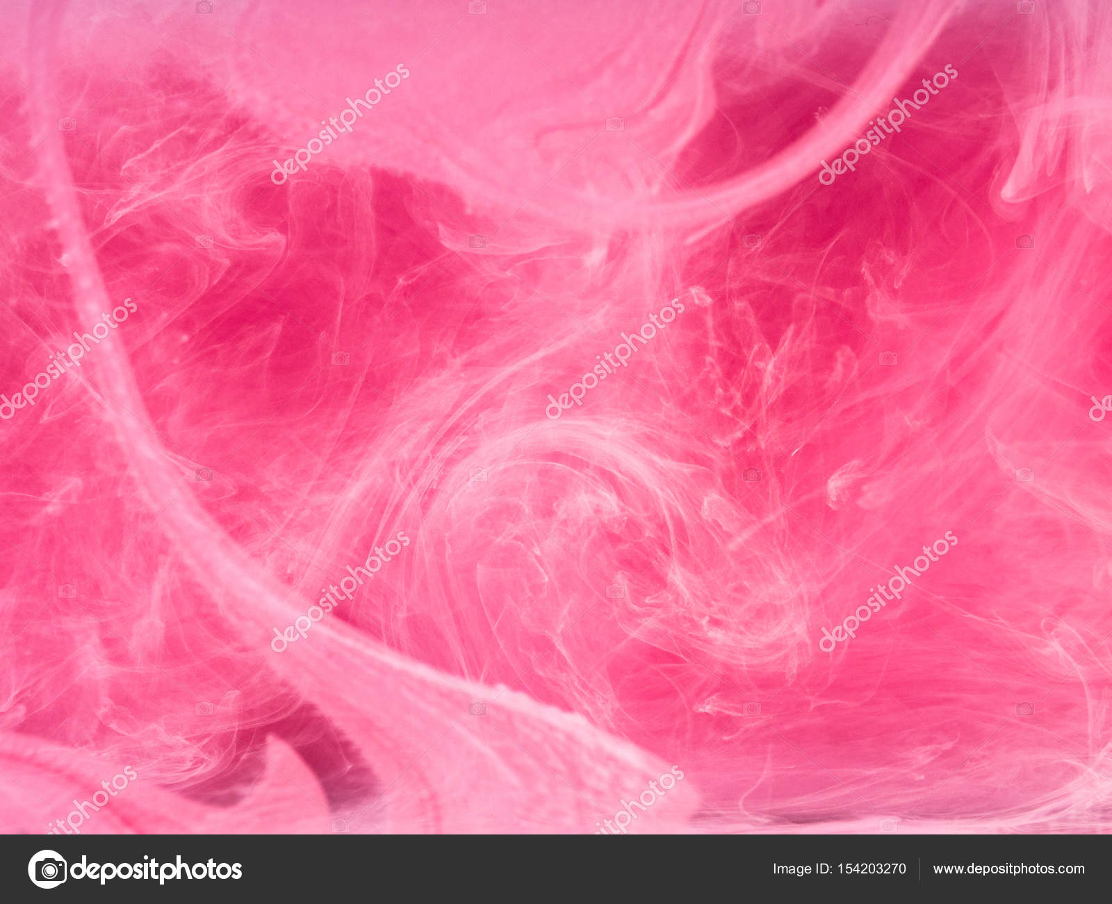 Abstract colored background. Pink smoke, ink in water, the patterns ...