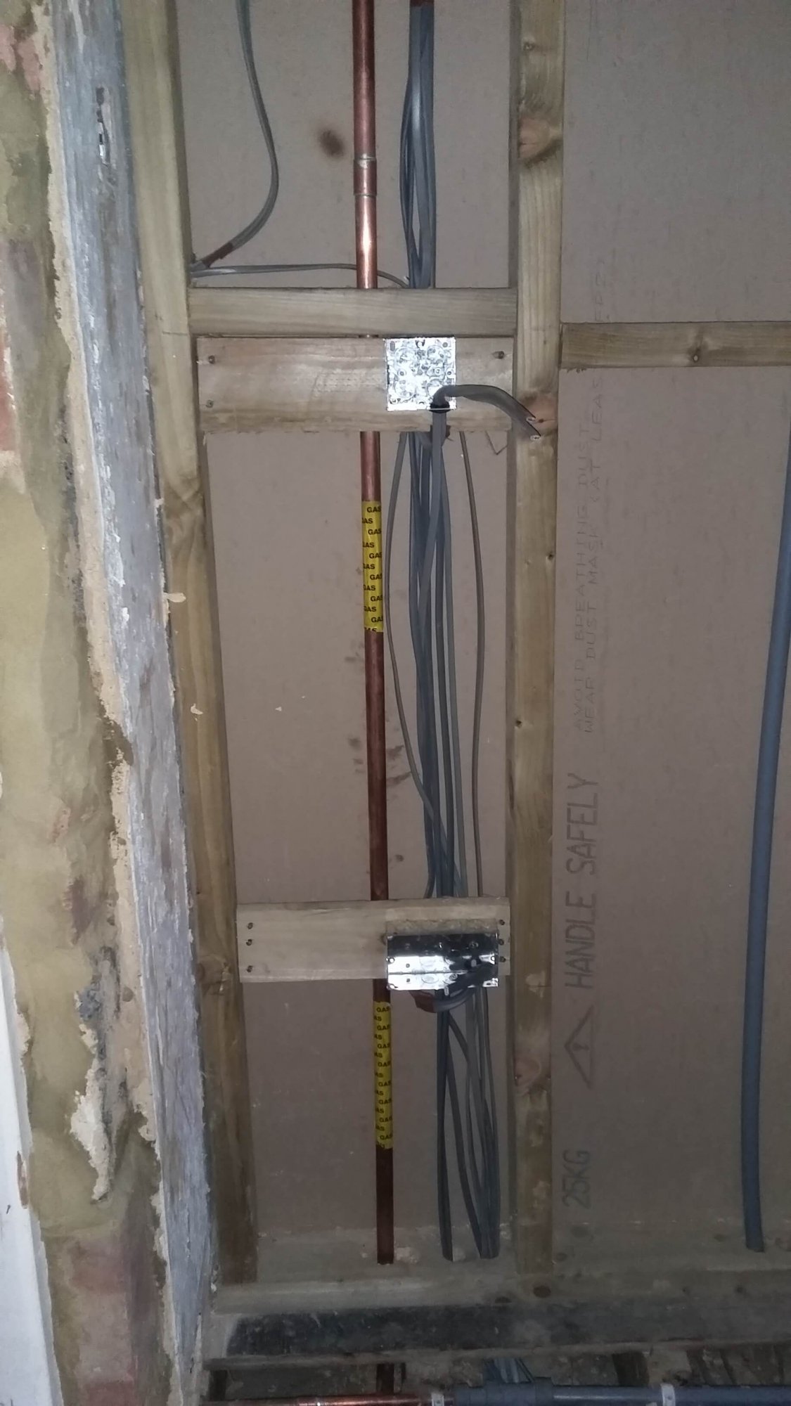 Should electric cable be so close to a gas pipe in stud wall ...