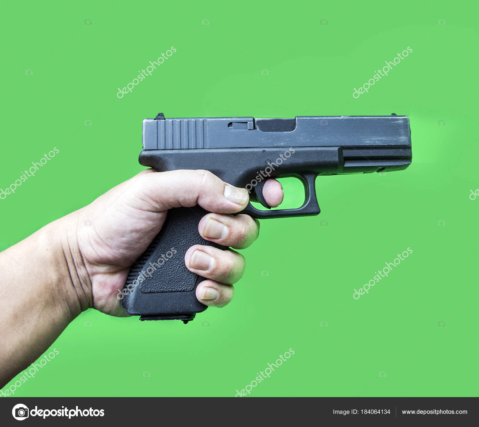 hand hold gun on green screen — Stock Photo © yanukit #184064134