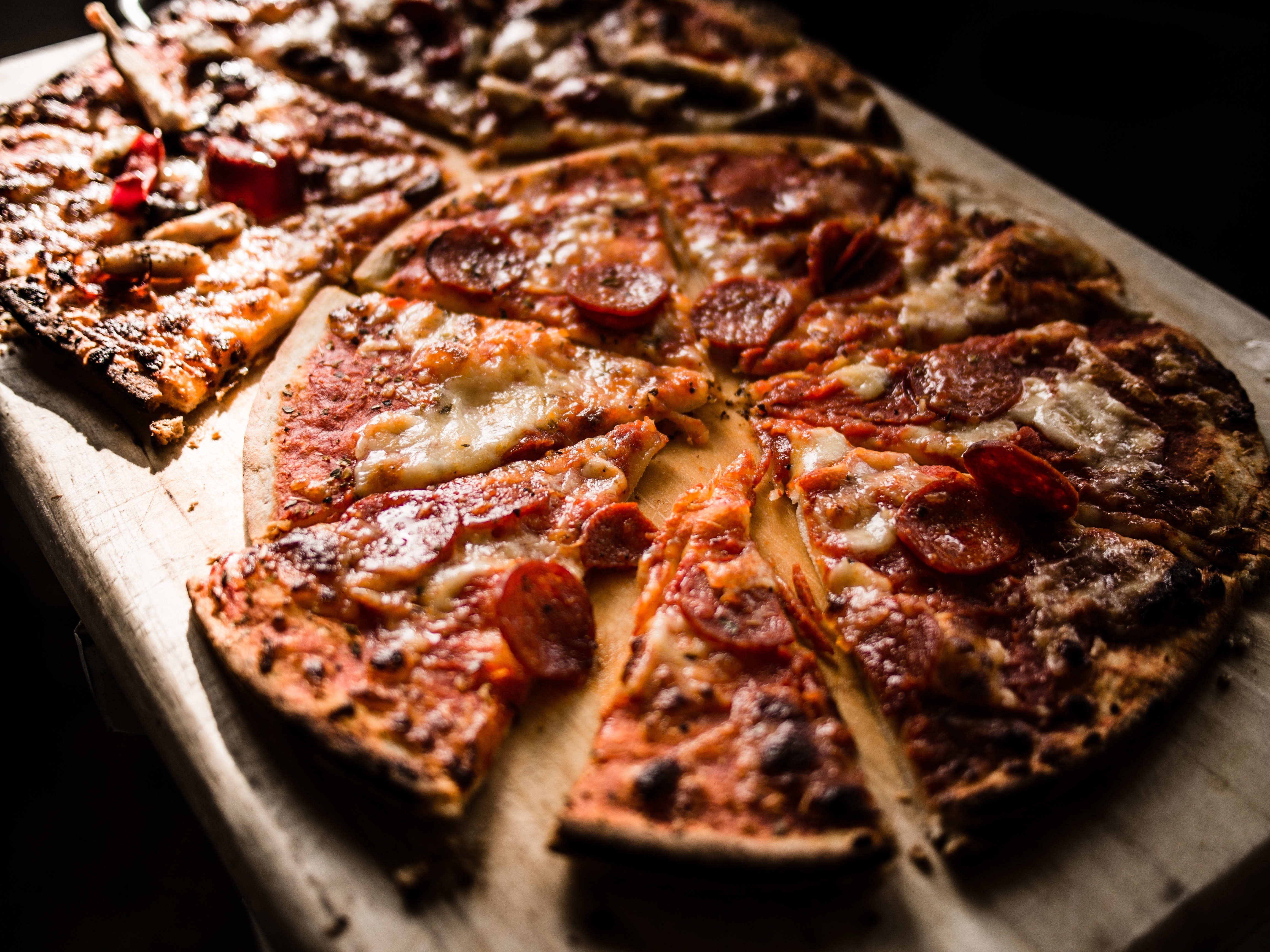 Pizza on brown wooden board photo