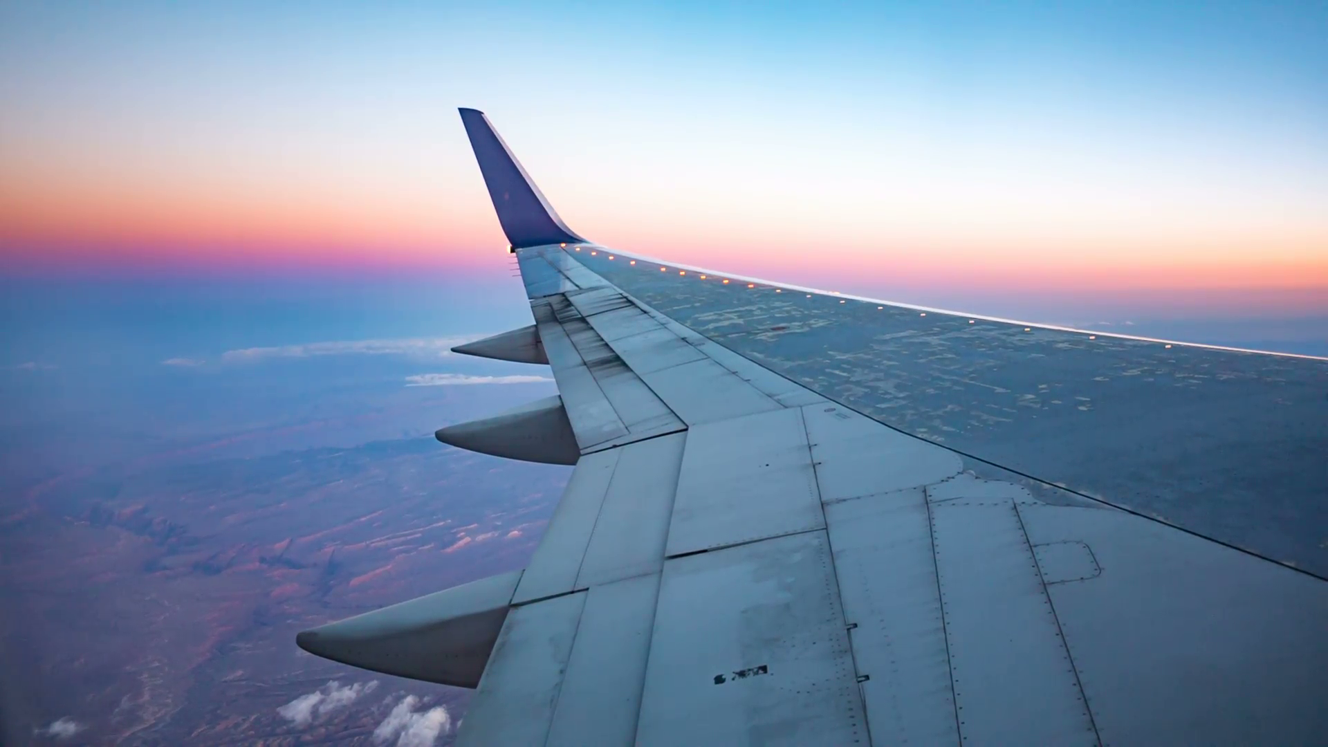 Plane Wing Aerial View During Sunset. view outside a plane window of ...