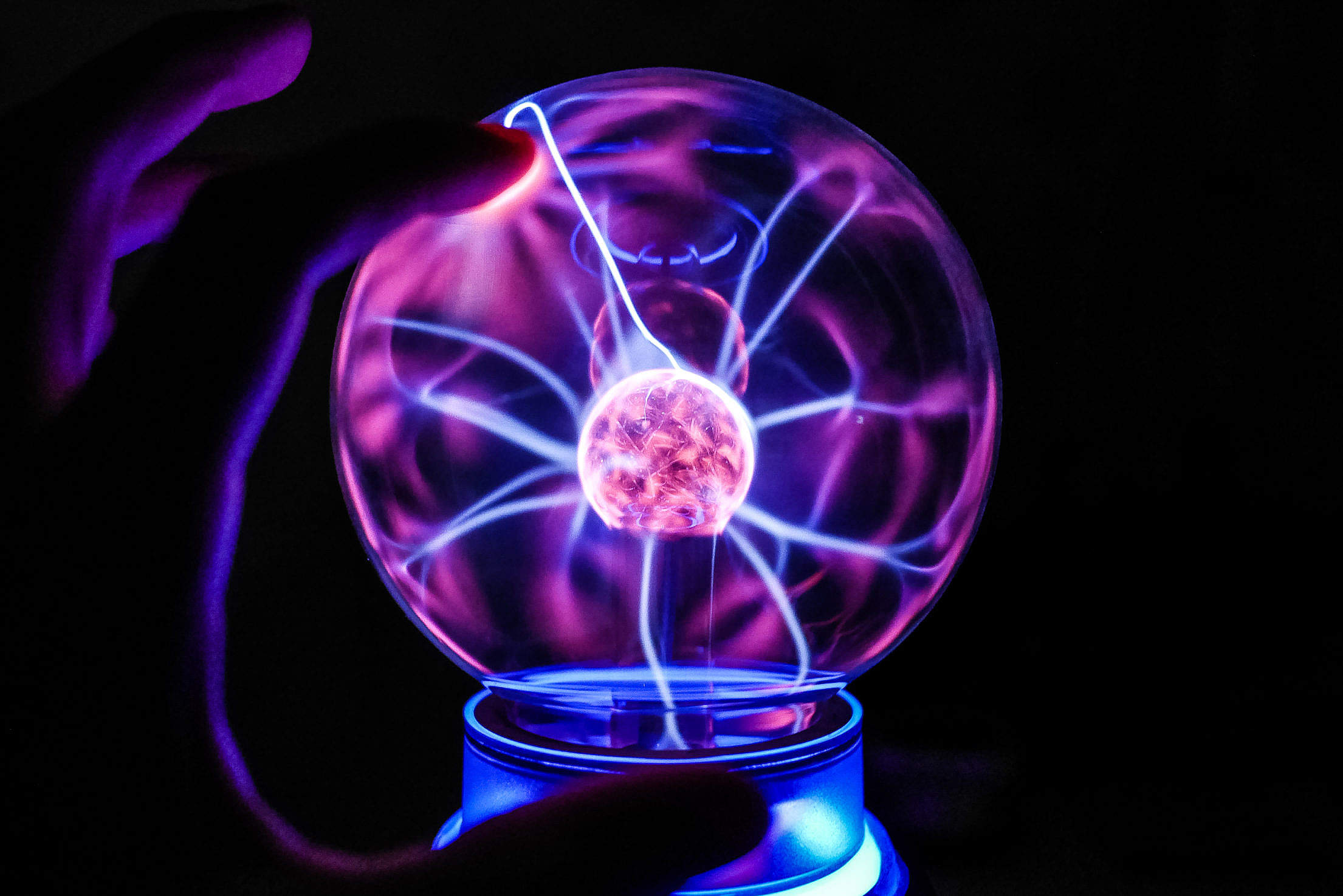 Touching The Plasma Ball Lamp Free Stock Photo Download | picjumbo