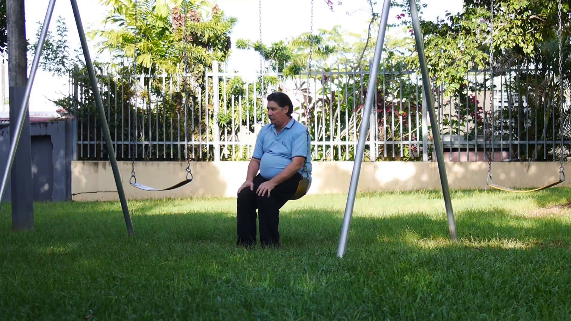 Old senior elderly mature man in playground swing. Lonely old man ...