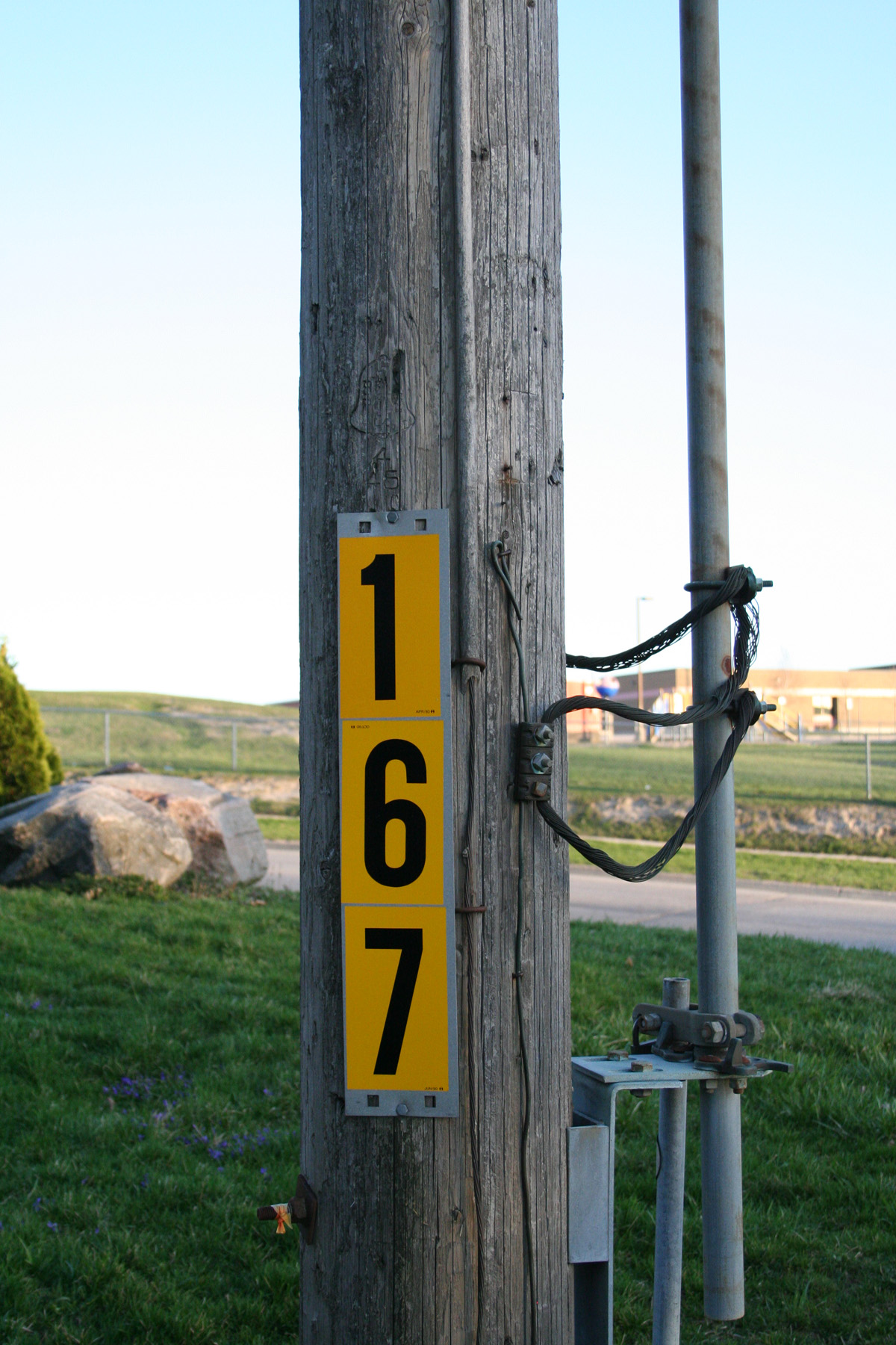 Pole with yellow sign photo