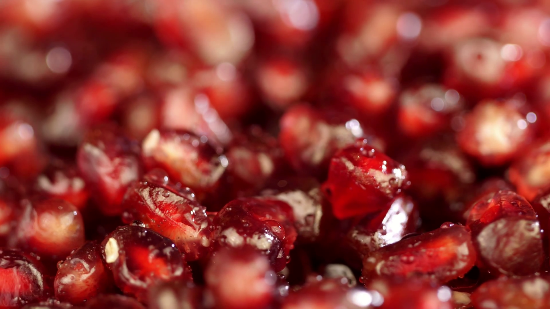Bright juicy pomegranate. Pomegranate grains on a white background ...