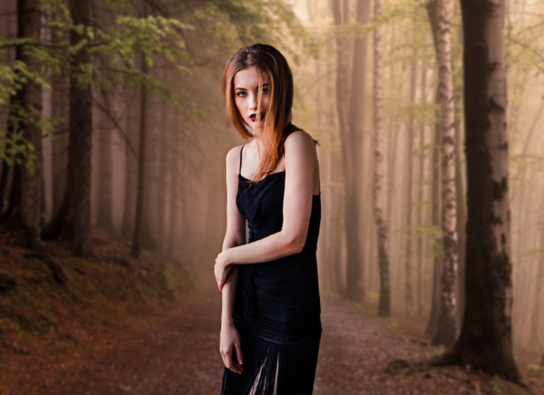 Portrait of young woman in forest photo