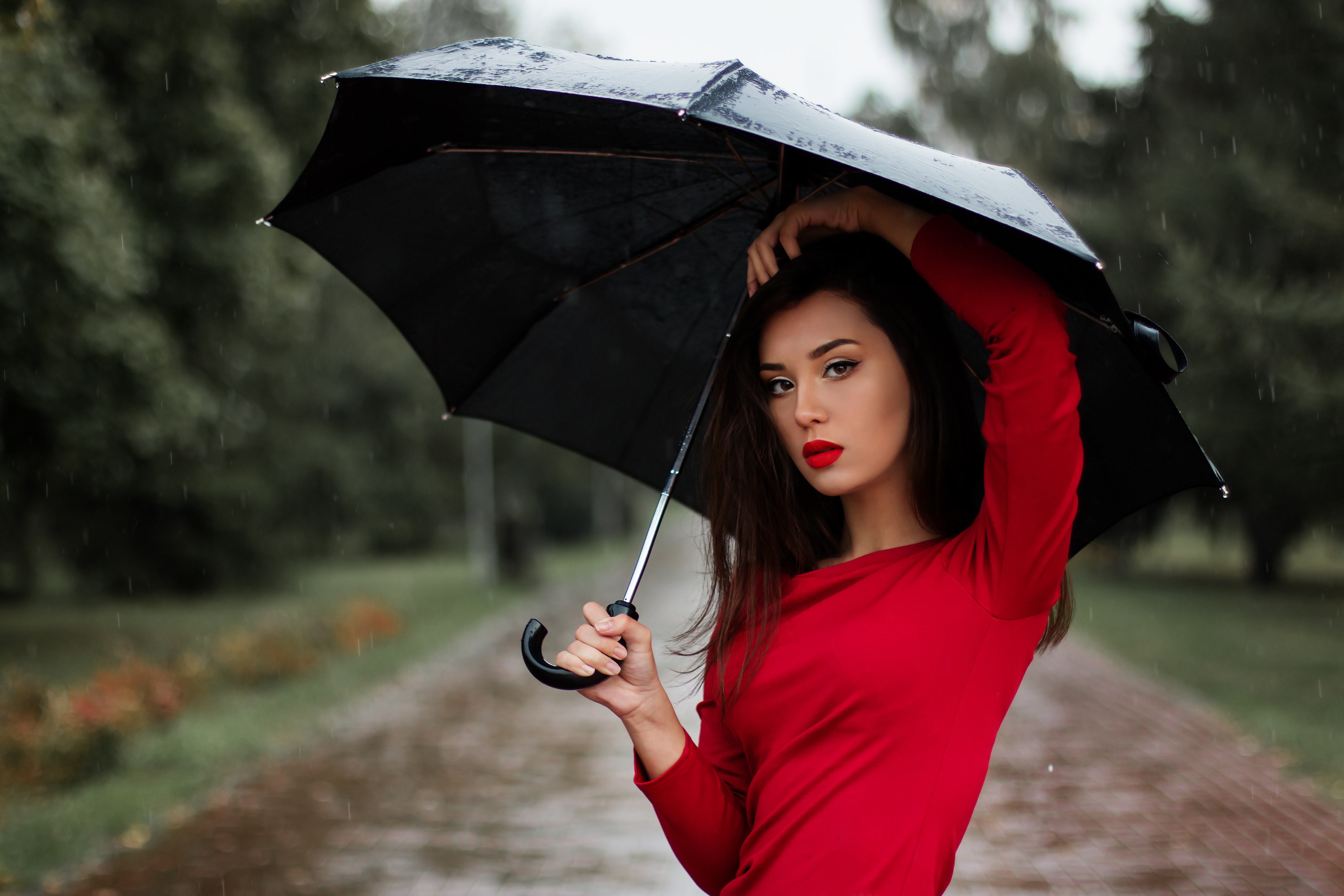 Portrait of young woman with umbrella photo