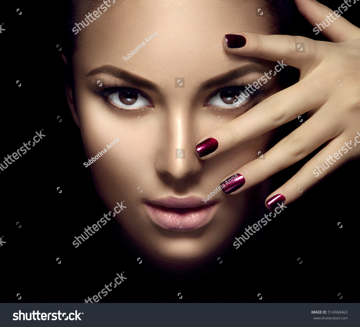Portrait photo of woman's purple matte lipstick