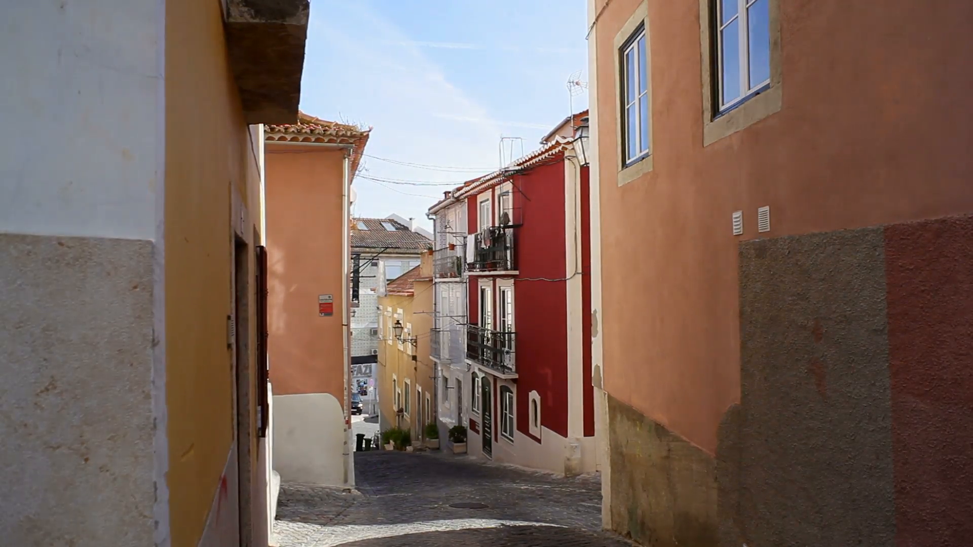 White sheets hang, old buildings, Lisbon narrow street, Portugal ...