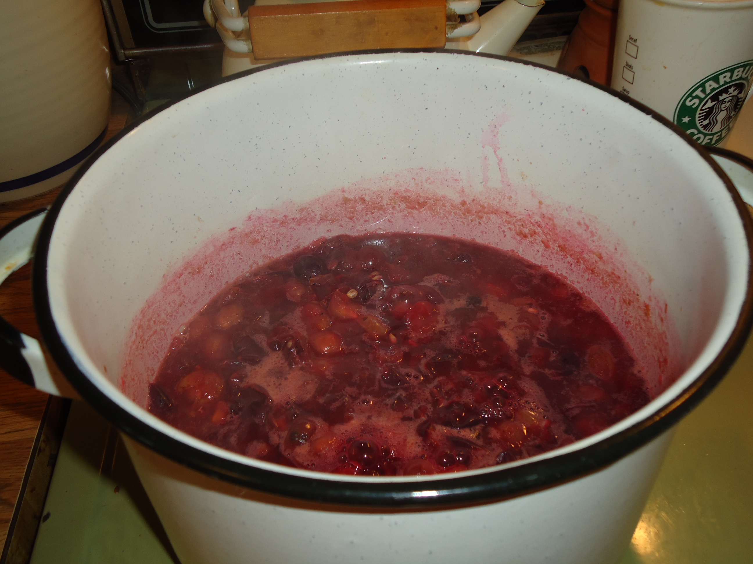 Pot of jam boiling on stove photo