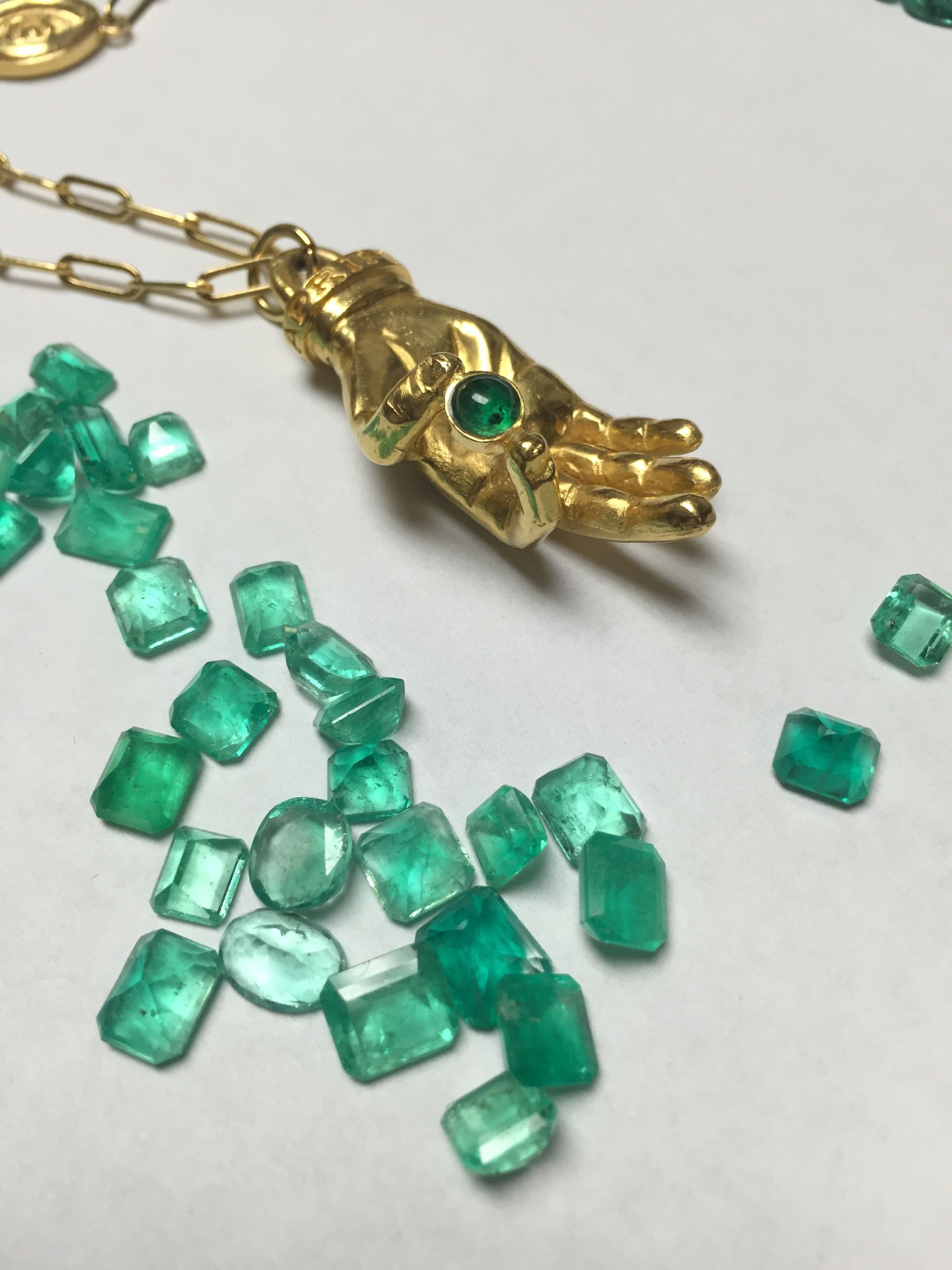 Emerald mudra amulet by Indigo Unveiled A precious gem sparkles in ...