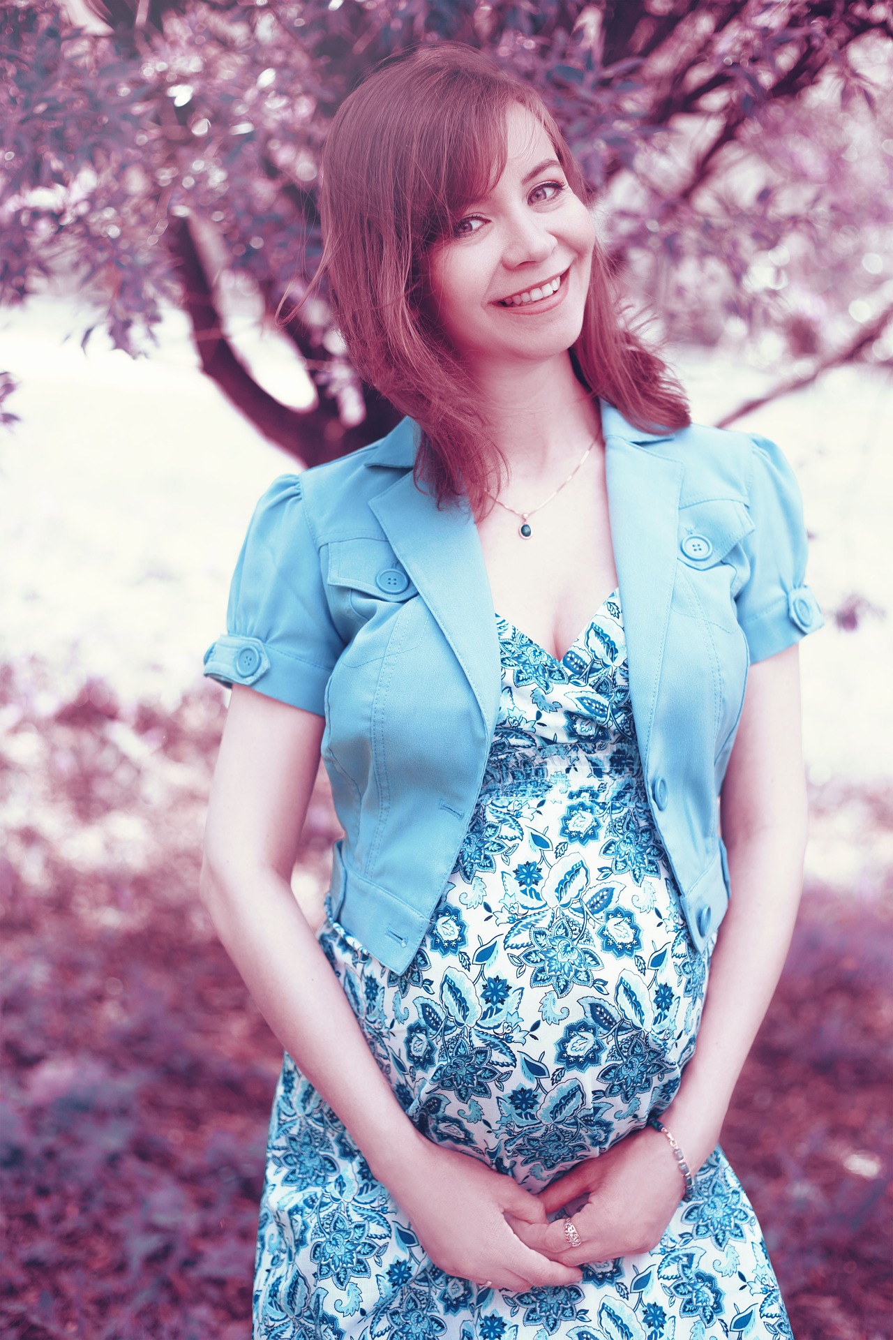 Pregnant woman in blue dress photo