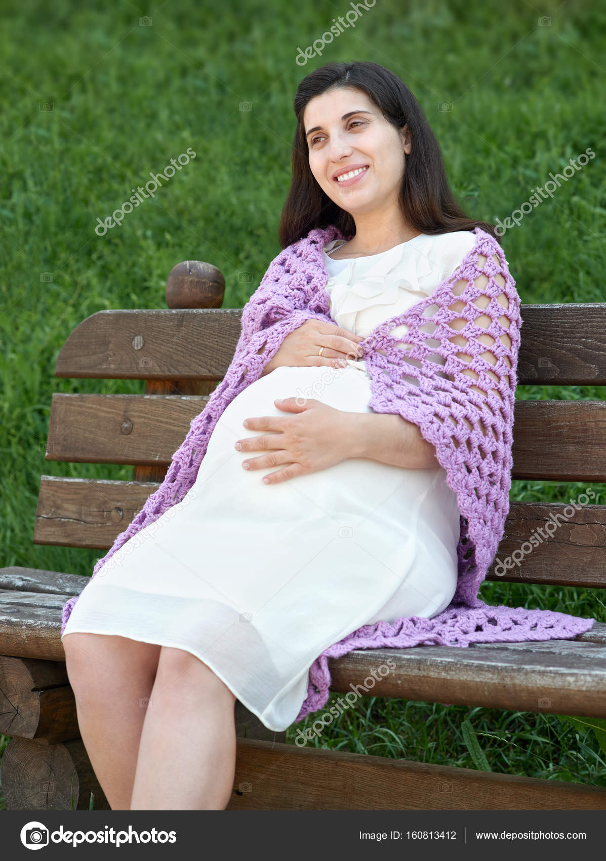 pregnant woman portrait, sit on bench in summer city park, bright ...