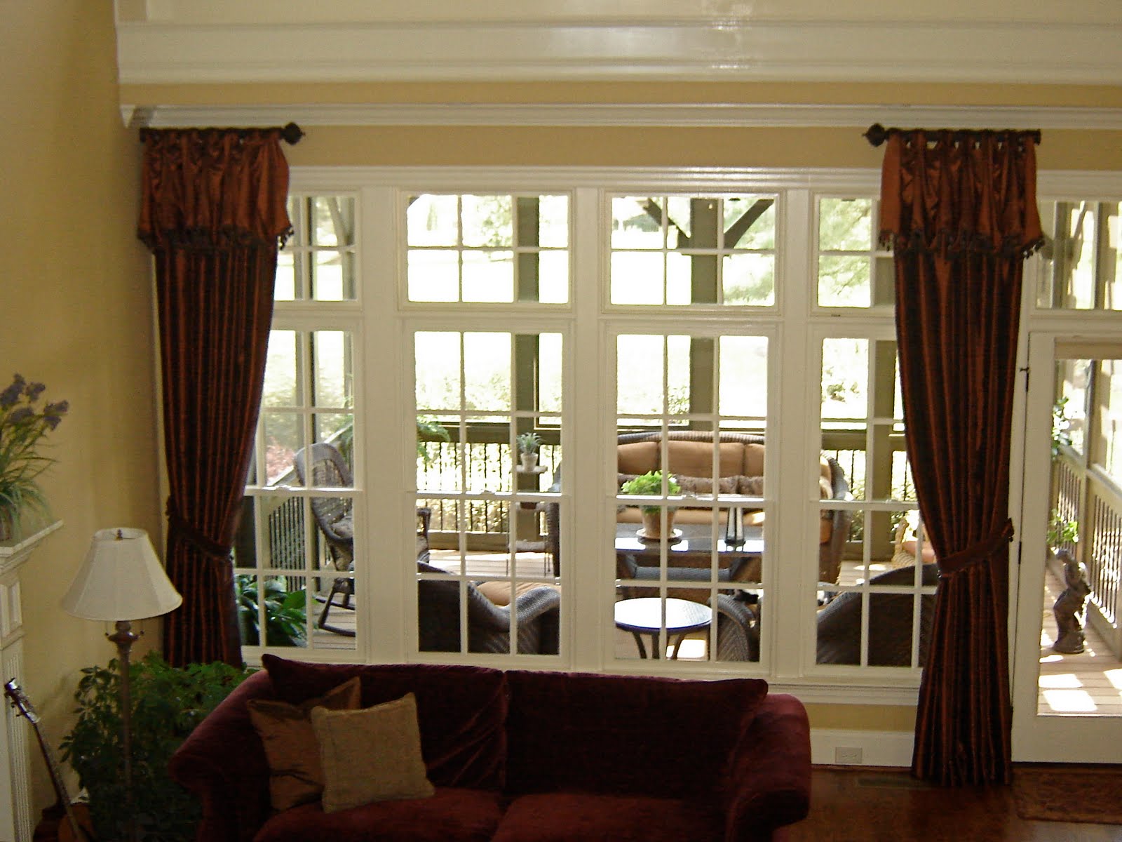 dark brown fabric curtains connected by glass windows with white ...