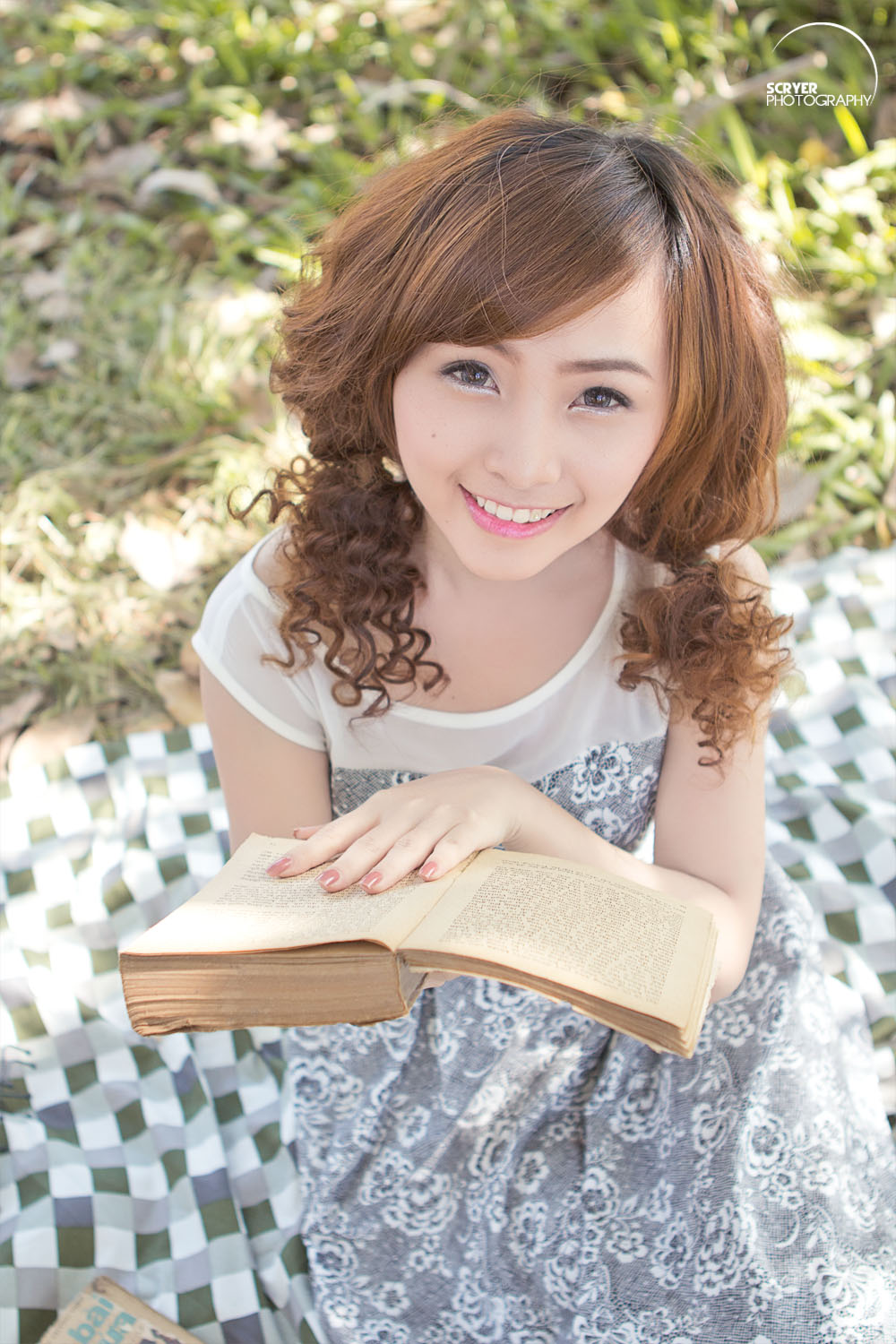 Pretty girl reading book photo