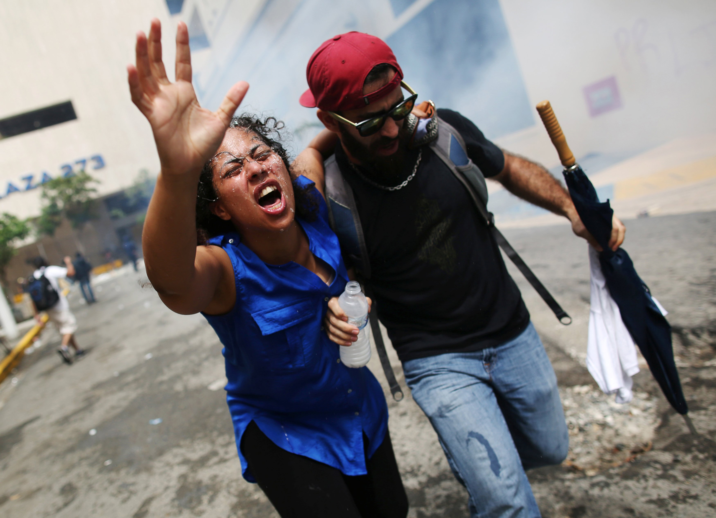 In Puerto Rico, protesters and police clash as thousands march in ...