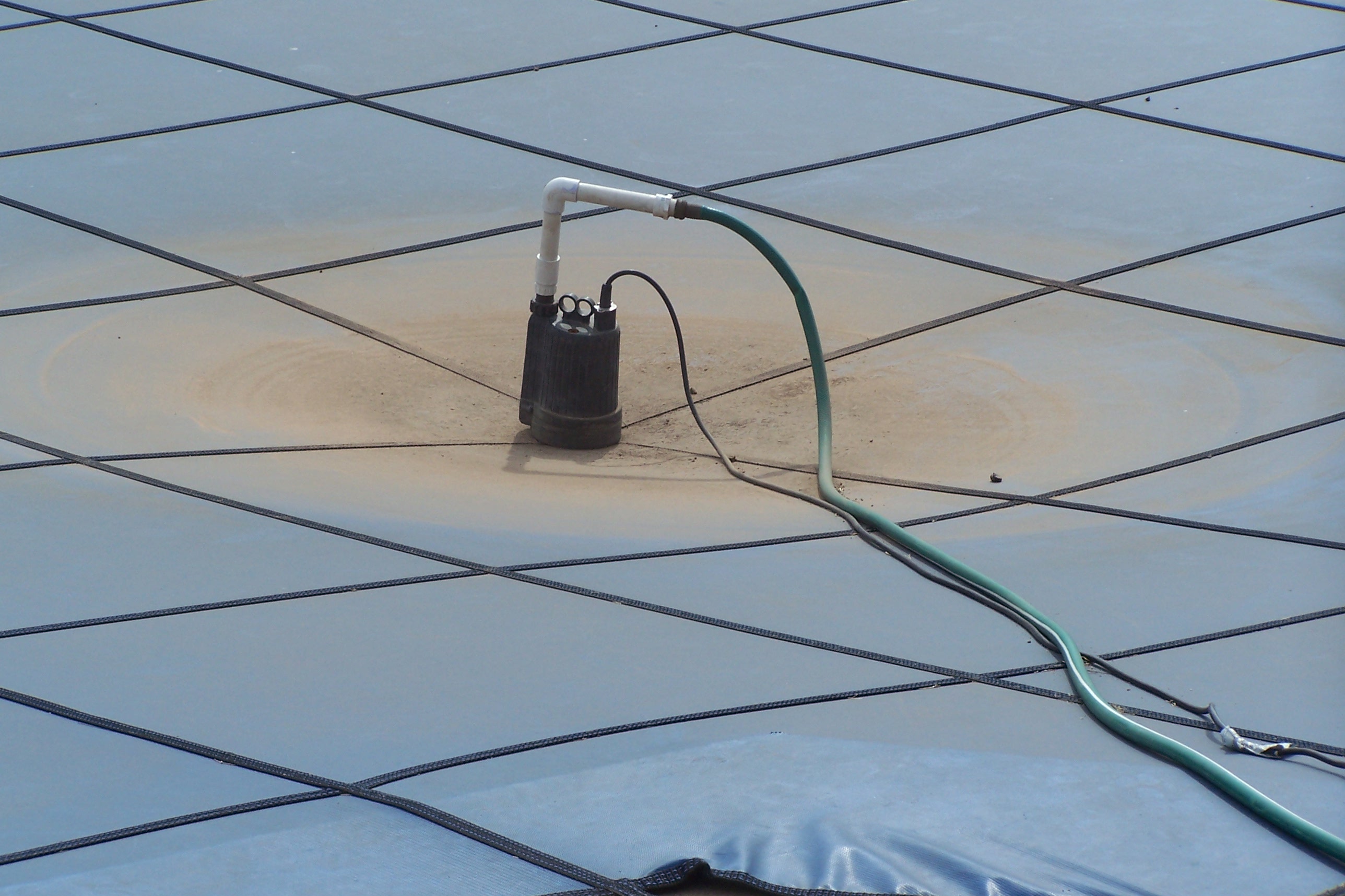 Pump on pool cover photo