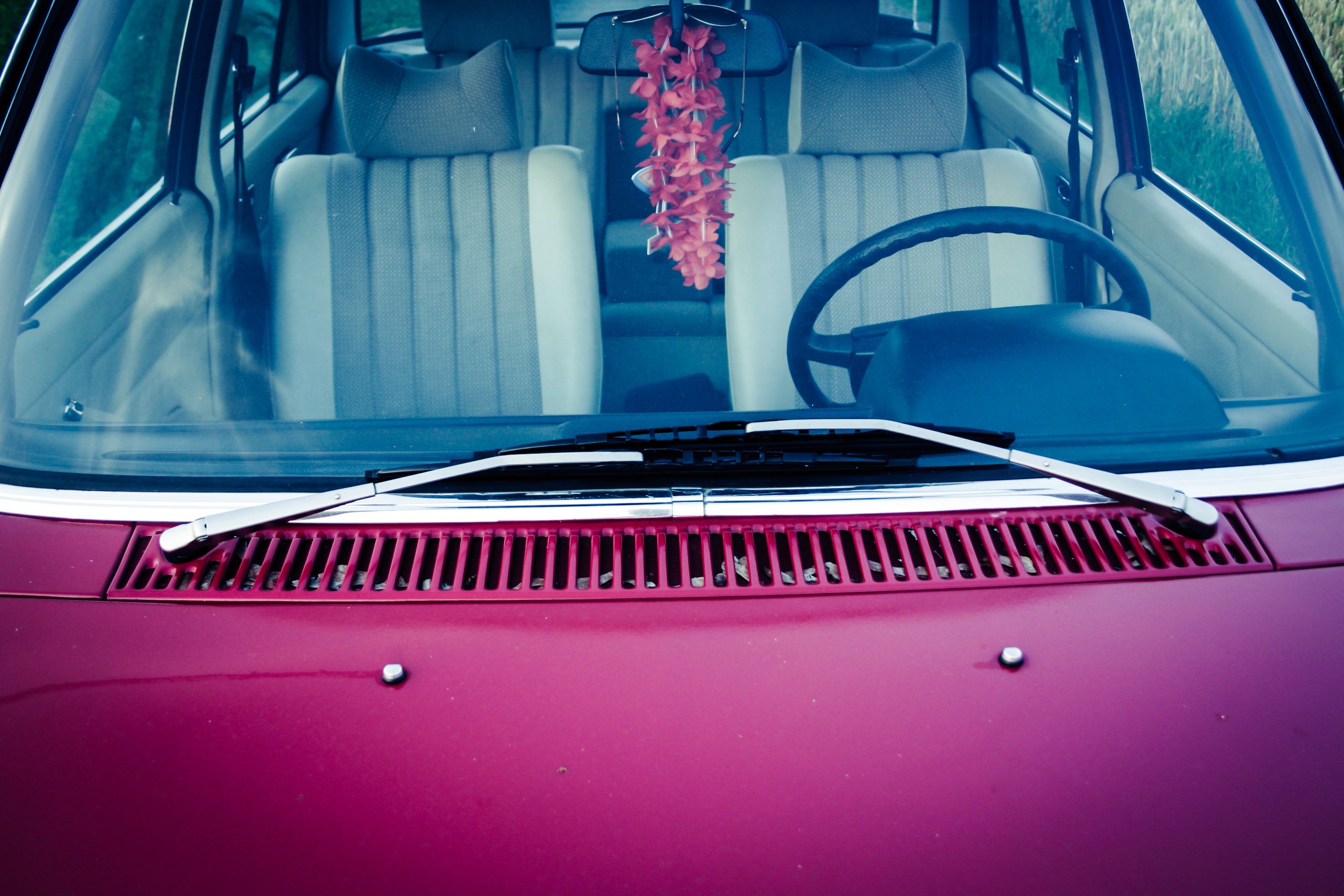 Purple car hood with stainless steel window wiper photo