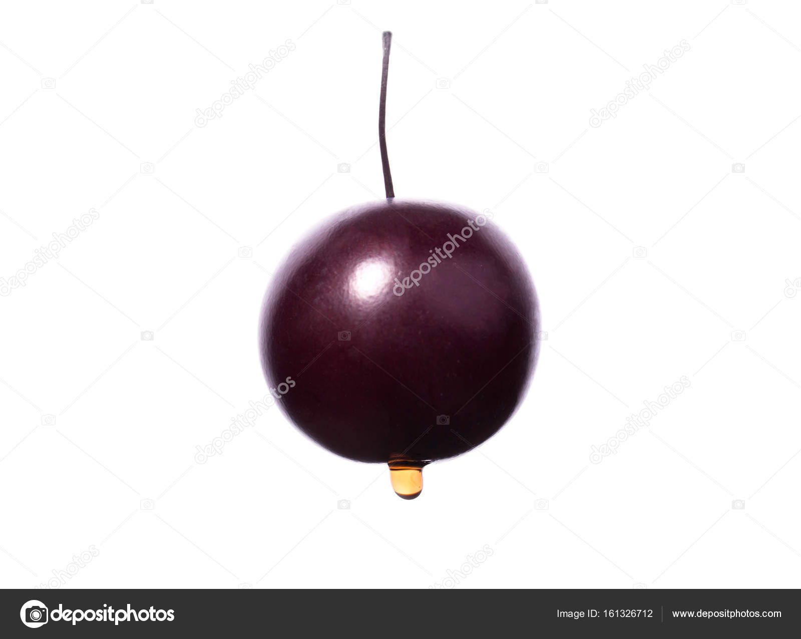 Juicy cherry with a shiny drop of water. A single purple cherry ...
