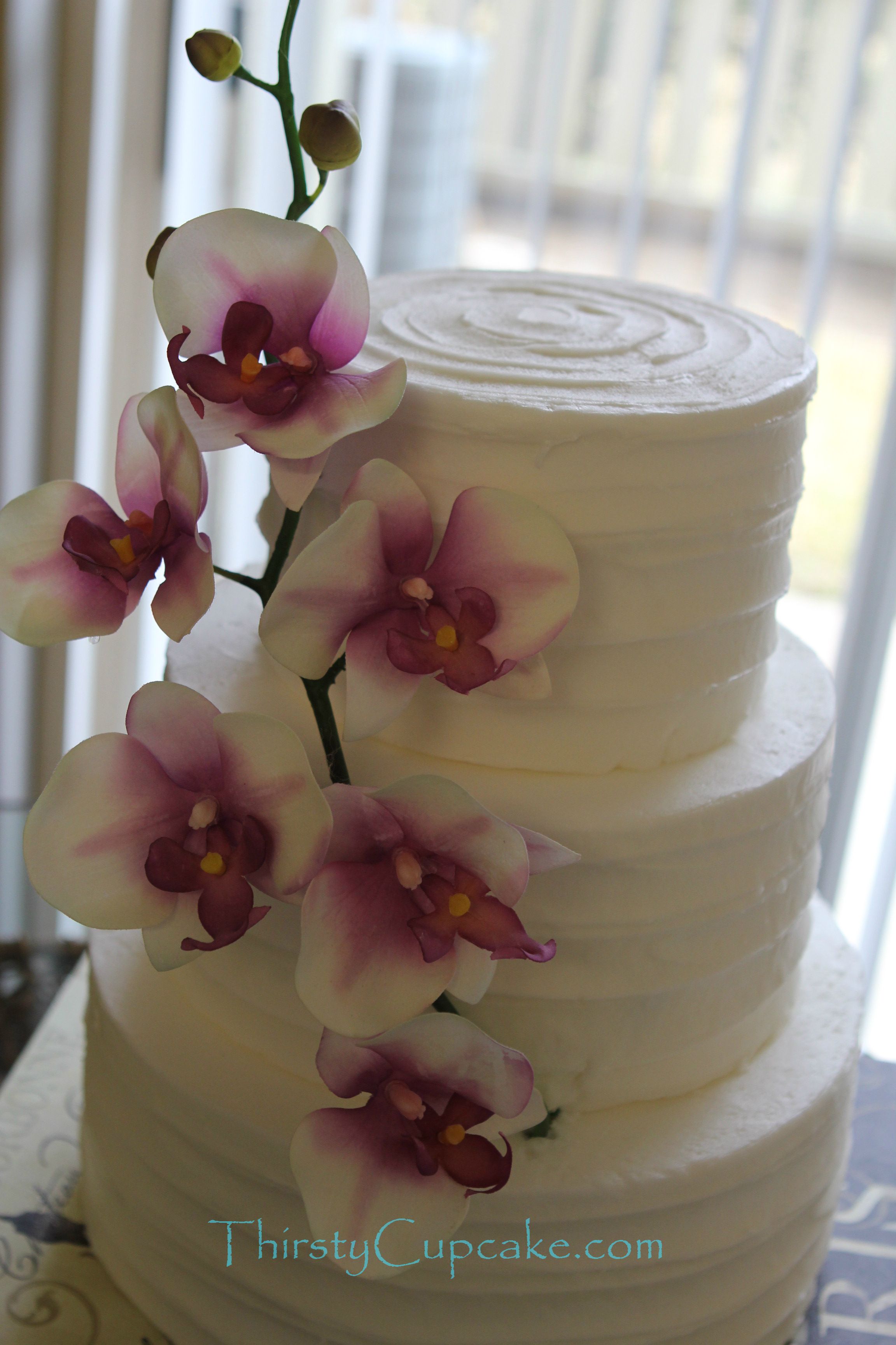 Rustic white 3 tiered wedding cake with spatula lined icing texture ...