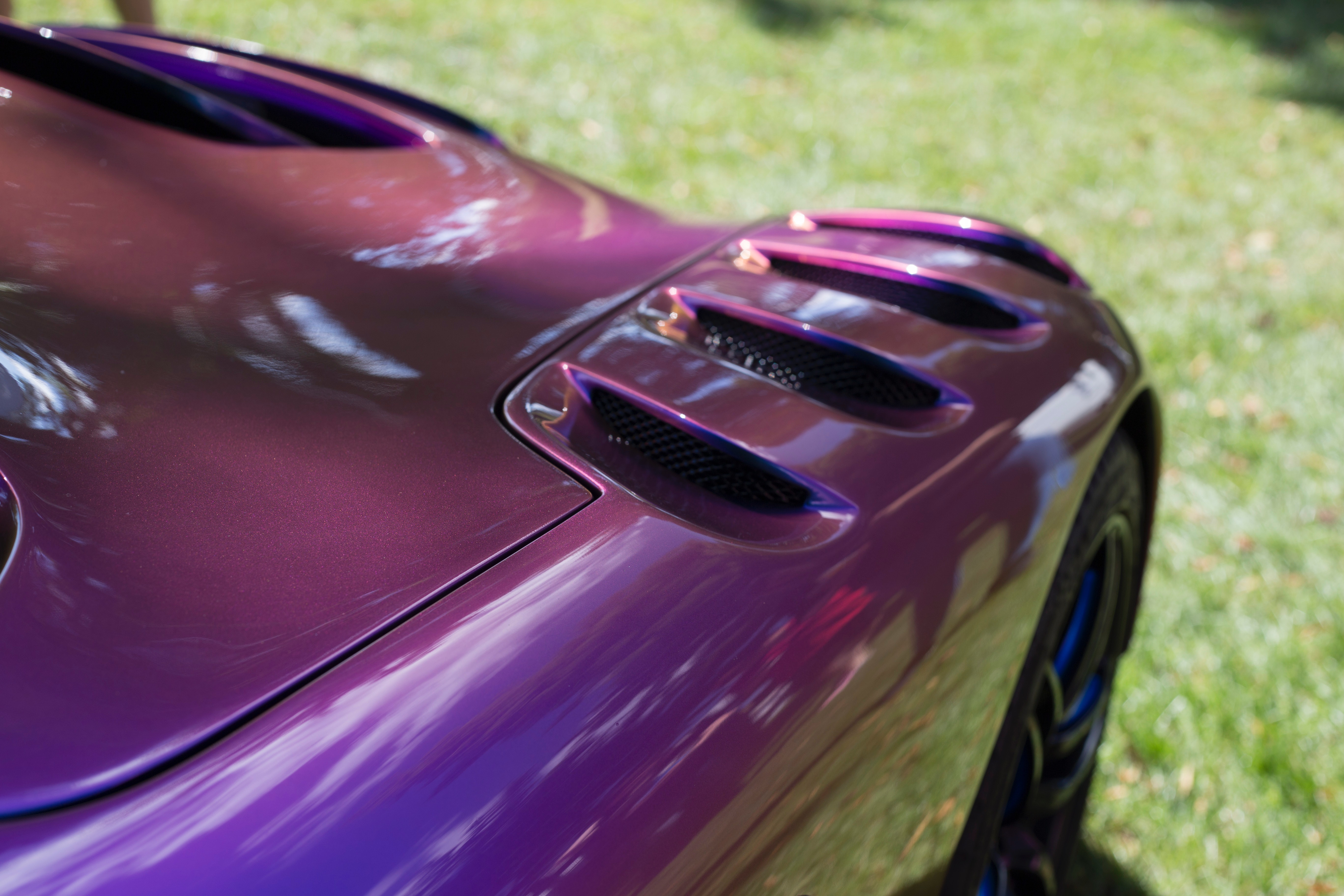 Purple sport car during daytime photo