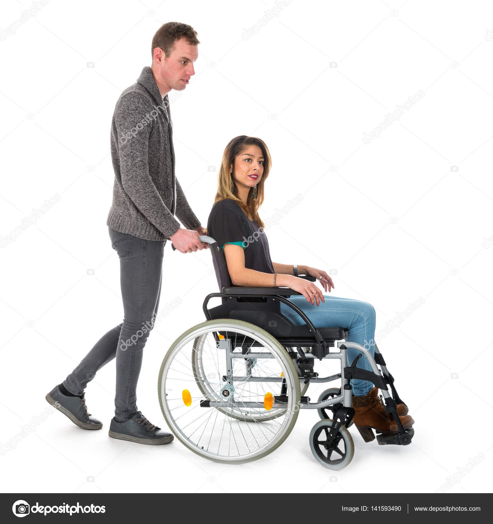 Man pushing woman in a wheelchair — Stock Photo © kruwt #141593490