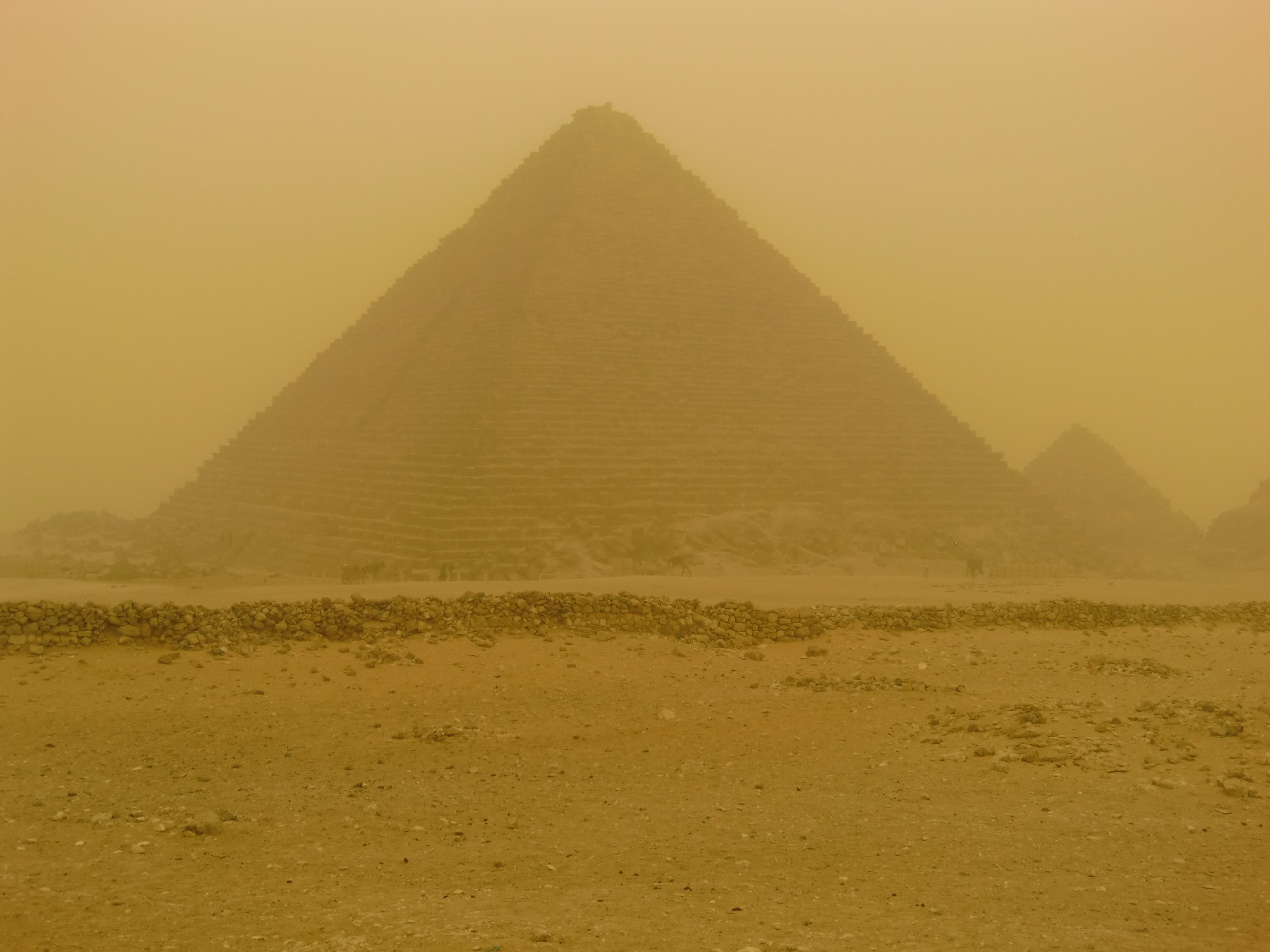 Pyramids in sandstorm photo
