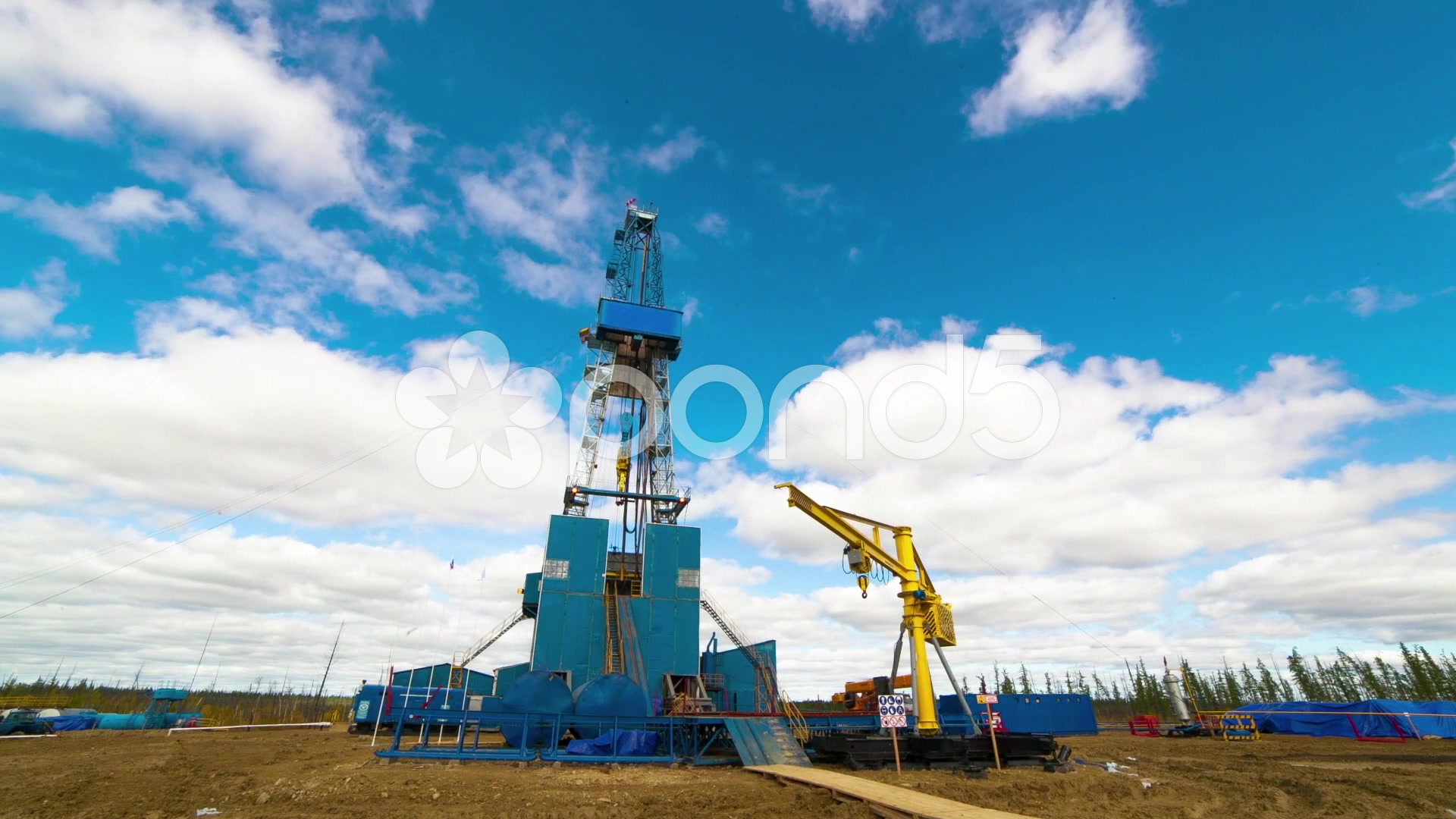Drilling rig and racing clouds. HD Timelapse ~ Hi Res #48442646