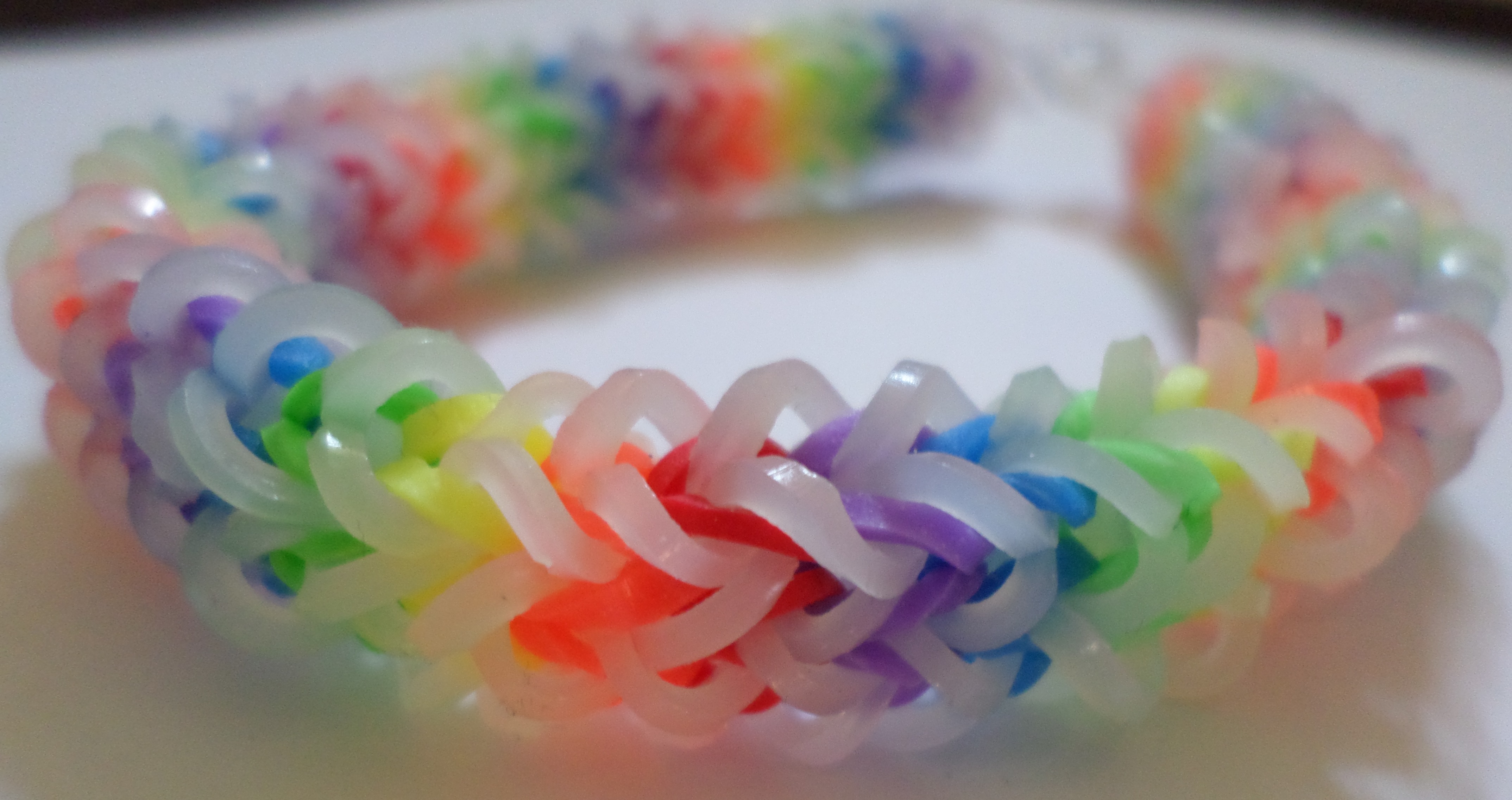 Rainbow loom rubber band bracelet hi-res stock photography and