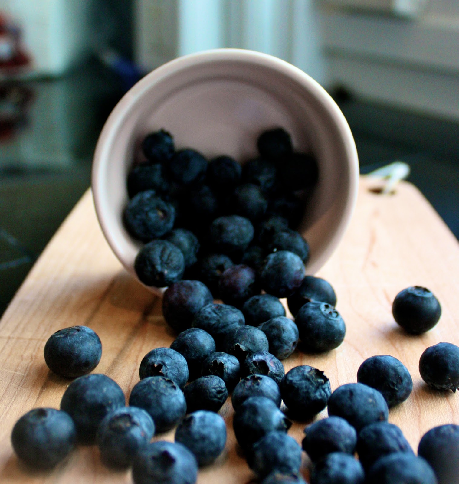 Raspberry beside blueberries photo