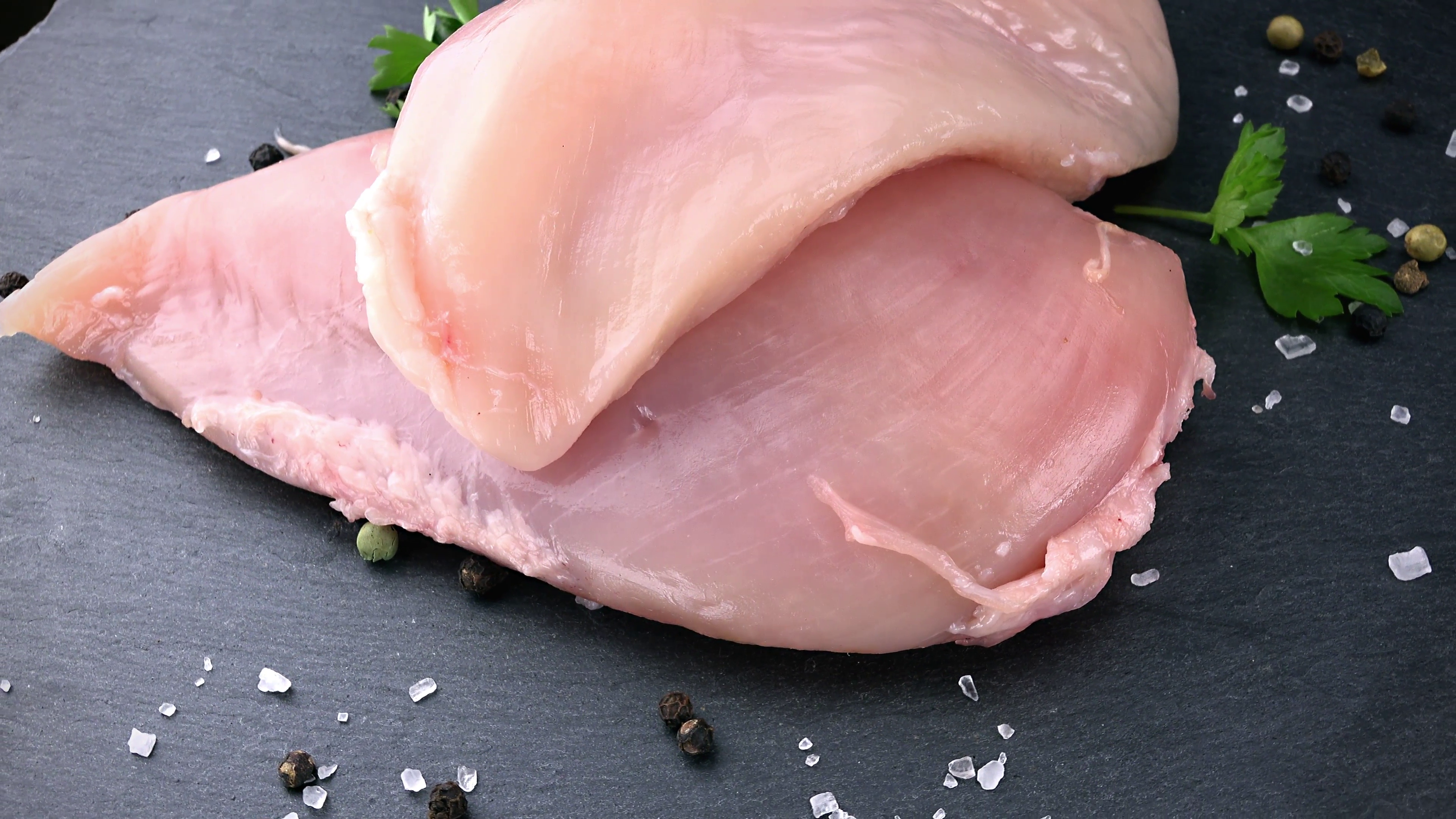 Raw Chicken Fillet as rotating, seamless loopable 4K footage Stock ...
