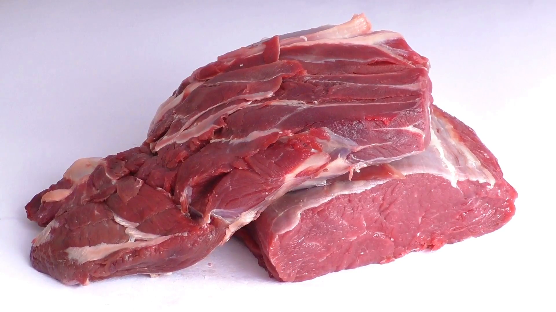 Raw beef meat isolated on white background Stock Video Footage ...