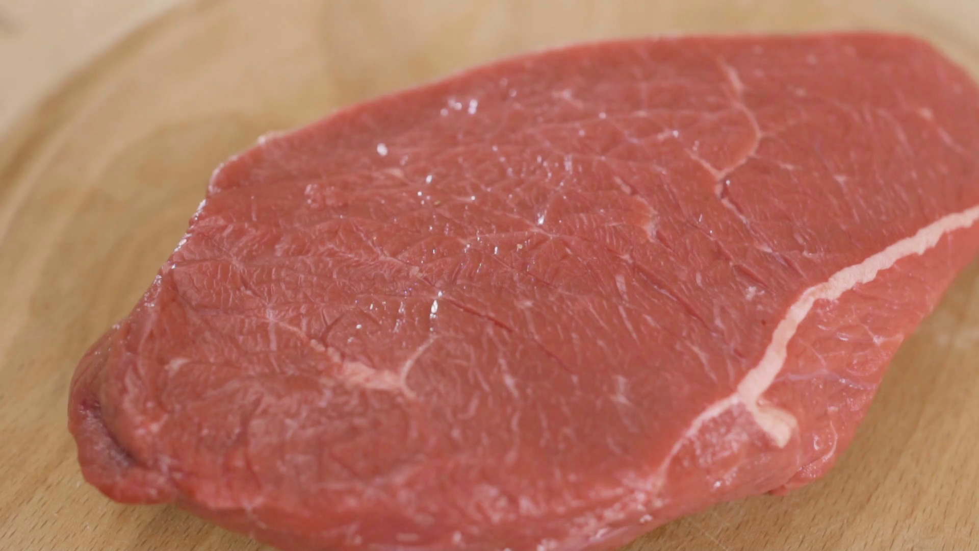 Sprinkling salt and pepper on raw red meat in slowmotion Stock Video ...